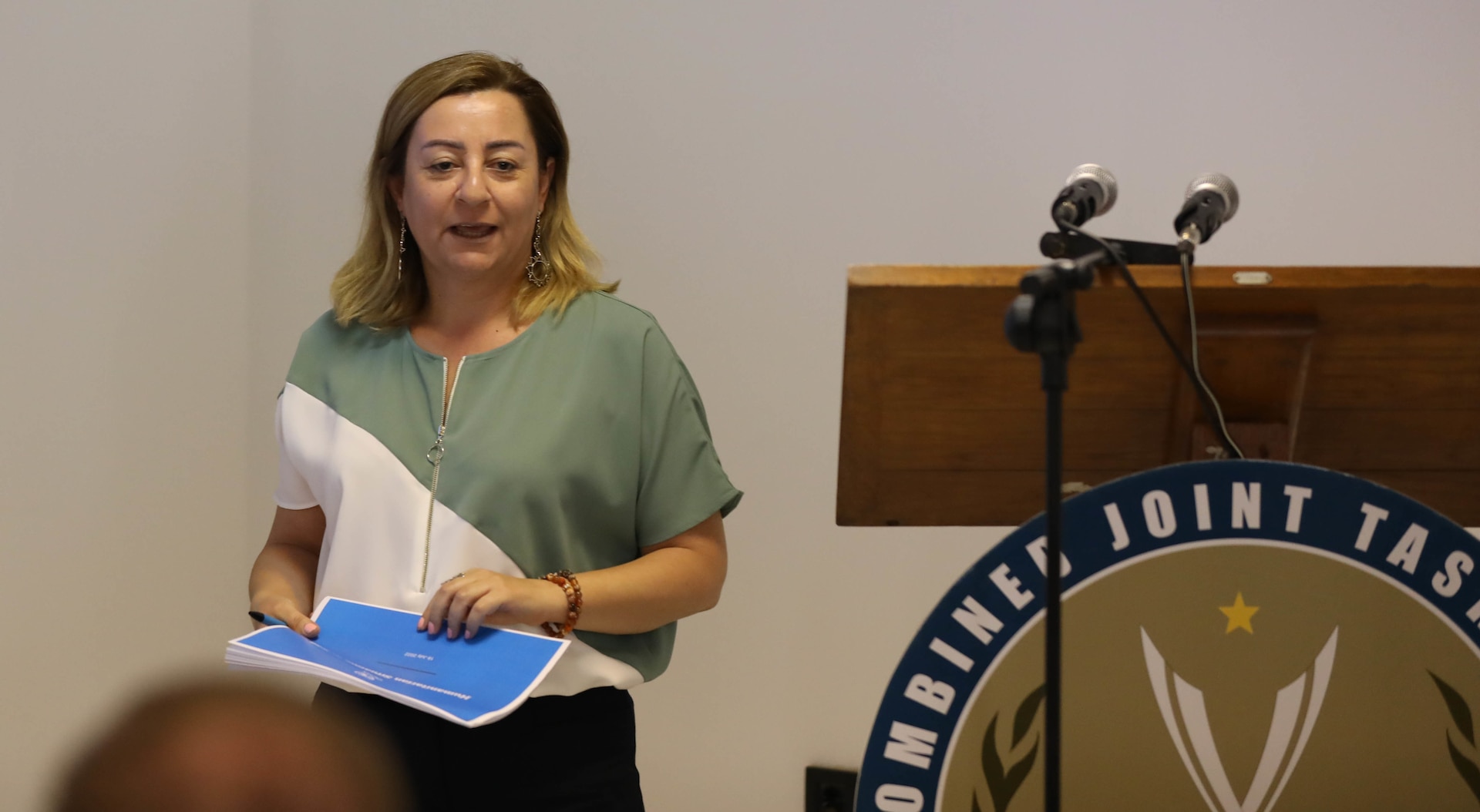 Monique Maani, the head of field coordination at the United Nations Office for the Coordination of Humanitarian Affairs in Baghdad, gives a presentation during a defense attaché forum July 19, 2022, in Baghdad, Iraq. The defense attaché forum brought together defense attachés from several Global Coalition countries as well as representatives from Combined Joint Task Force - Operation Inherent Resolve (CJTF-OIR) and interagency partners to discuss topics including the need for increased repatriation and reintegration of displaced persons in northeast Syria and within Iraq to reduce ISIS influence in those vulnerable populations; the threat of ISIS members in detention centers operated by Syrian Democratic Forces in northeast Syria; and the need for greater international action to address these ongoing security and humanitarian challenges. (U.S. Army photo by Sgt. Brian Reed)