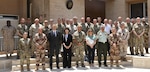 Attendees at a defense attaché forum hosted by Combined Joint Task Force - Operation Inherent Resolve (CJTF-OIR) pose for a photo July 19, 2022, in Baghdad, Iraq. The defense attaché forum brought together defense attachés from several Global Coalition countries as well as representatives from CJTF-OIR and interagency partners to discuss topics including the need for increased repatriation and reintegration of displaced persons in northeast Syria to reduce ISIS influence in those vulnerable populations; the threat of ISIS members in detention centers operated by Syrian Democratic Forces in northeast Syria; and the need for greater international action to address these ongoing security and humanitarian challenges. (U.S. Army photo by Sgt. Brian Reed)