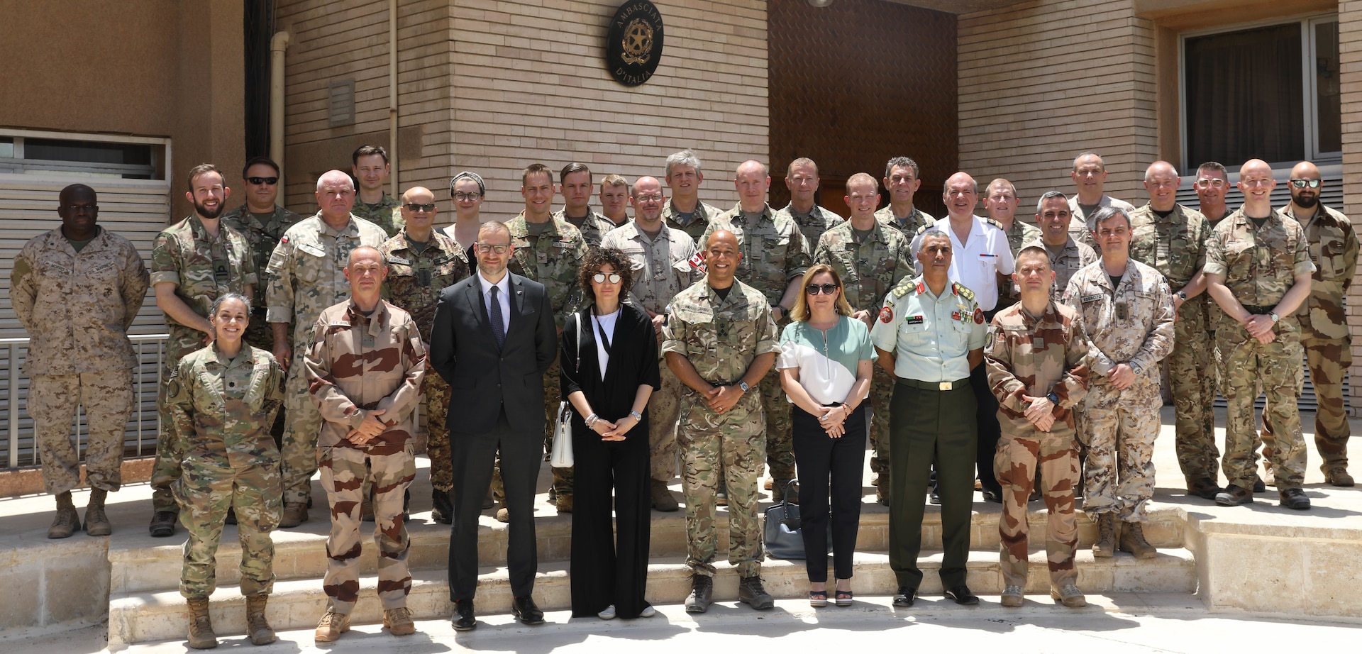 Attendees at a defense attaché forum hosted by Combined Joint Task Force - Operation Inherent Resolve (CJTF-OIR) pose for a photo July 19, 2022, in Baghdad, Iraq. The defense attaché forum brought together defense attachés from several Global Coalition countries as well as representatives from CJTF-OIR and interagency partners to discuss topics including the need for increased repatriation and reintegration of displaced persons in northeast Syria to reduce ISIS influence in those vulnerable populations; the threat of ISIS members in detention centers operated by Syrian Democratic Forces in northeast Syria; and the need for greater international action to address these ongoing security and humanitarian challenges. (U.S. Army photo by Sgt. Brian Reed)