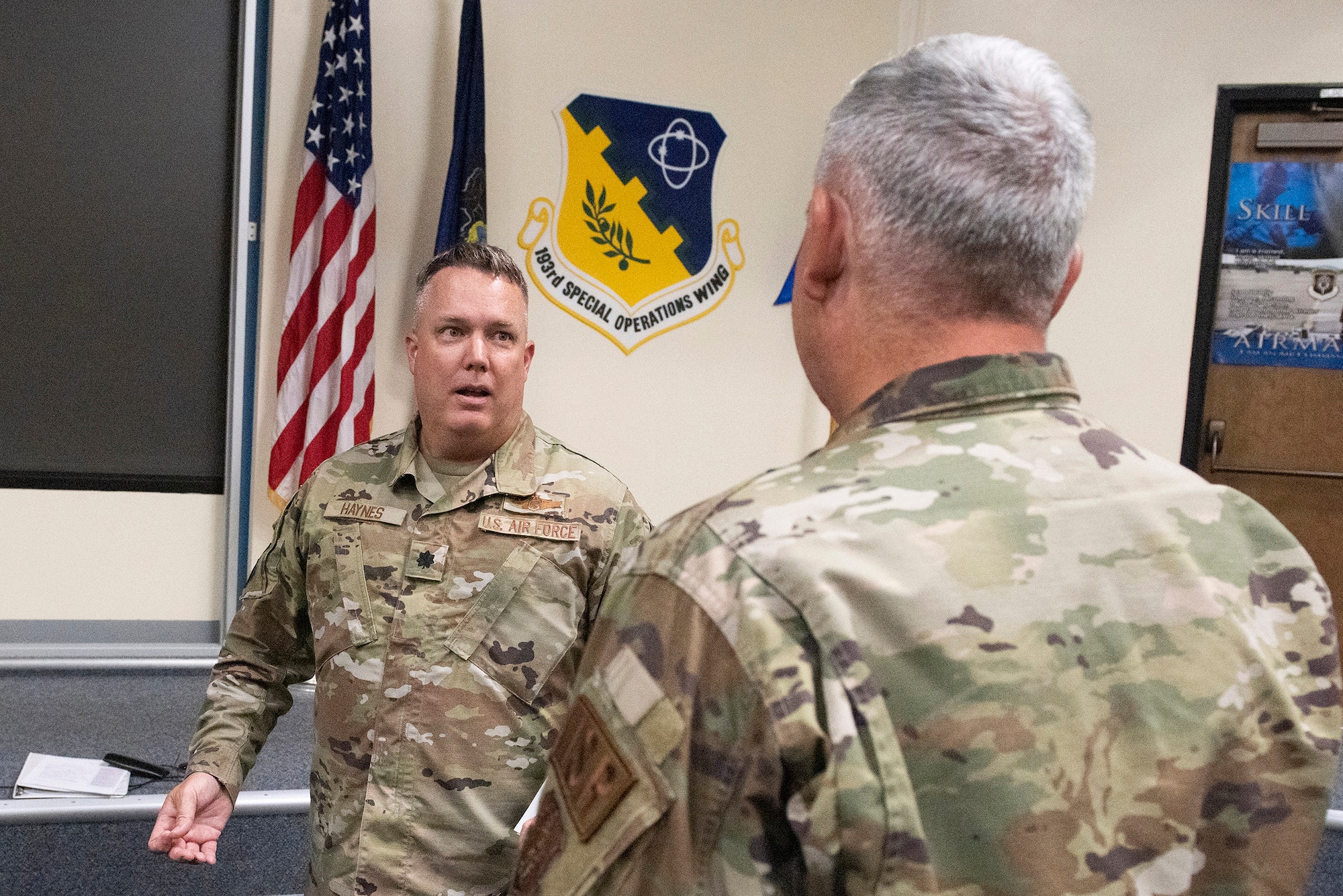 U.S. Air Force Lt. Col. John Haynes, the Air National Guard Advisor to Air Force Special Operations Command, goes over a few points with Col. Scott Harron, 193rd Special Operations Mission Support Group commander