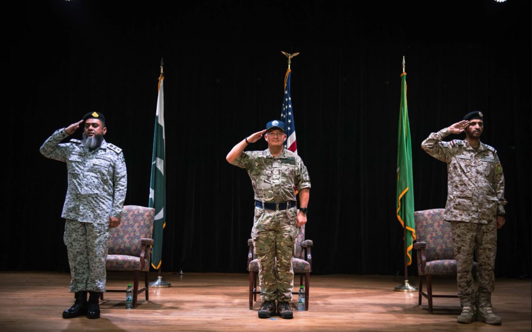 MANAMA, Bahrain (July 21, 2022) Pakistan Navy Commodore Vaqar Muhammad, left; United Kingdom Royal Navy Commodore Adrian Fryer, Combined Maritime Forces deputy commander, center; and Royal Saudi Navy Commodore Abdullah Al-Mutairi, incoming Combined Task Force (CTF) 150 commander, salute during a change of command ceremony at Naval Support Activity Bahrain, July 21. During the ceremony, Al-Mutairi assumed command of CTF 150 from Vaqar. (U.S. Navy photo by Mass Communication Specialist 1st Class Andrew Schneider)