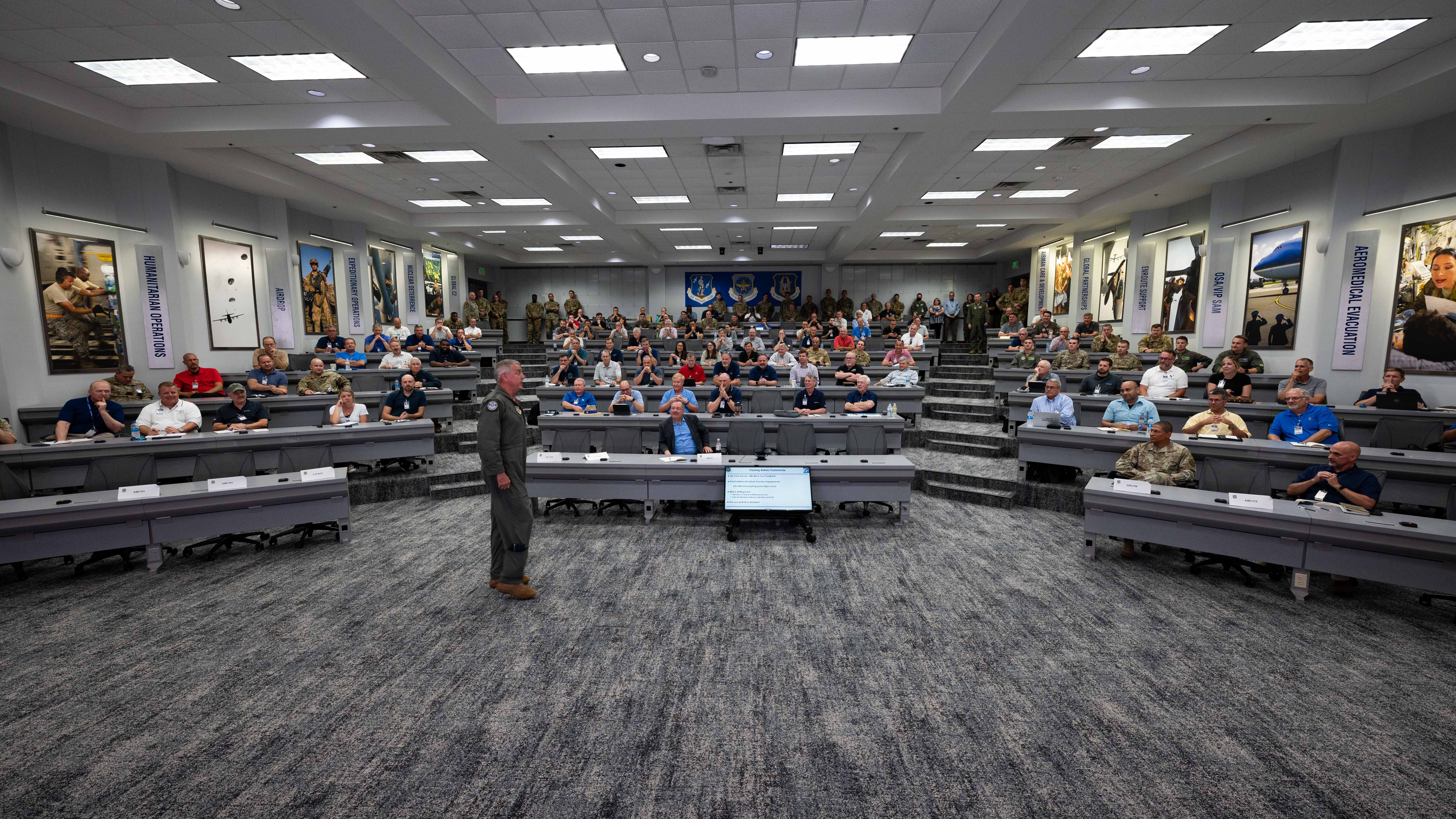 Gen. Mike Minihan, commander of Air Mobility Command, speaks to attendees of the AMC Summer Industry Preview at Scott Air Force Base, Illinois, July 12, 2022.