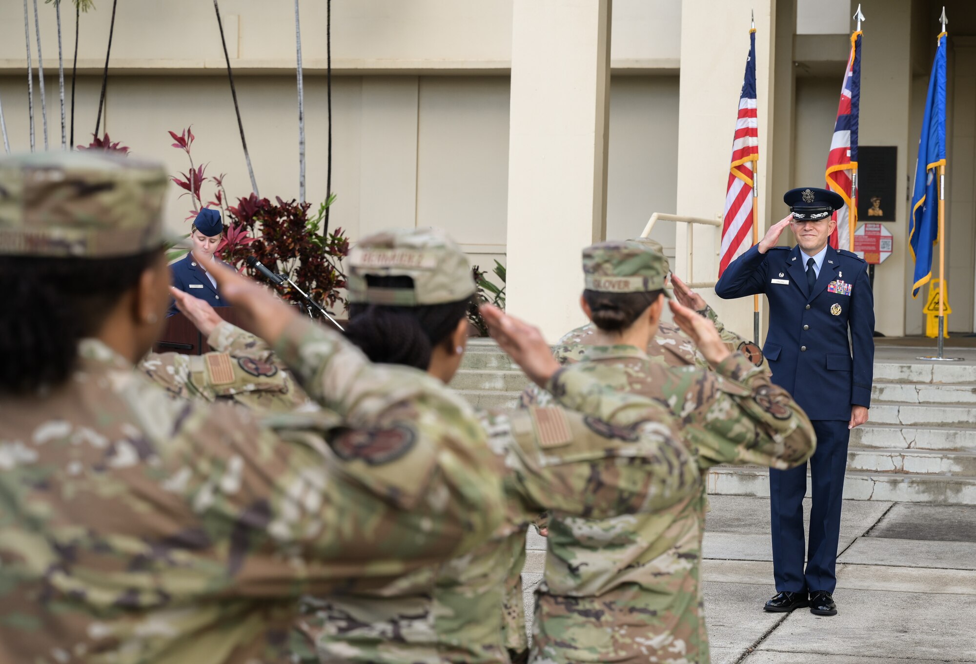Lt. Col. Joseph Sanchez, 15th Healthcare Operations Squadron commander, receives his first salute during a change of command ceremony at Joint Base Pearl Harbor-Hickam, Hawaii, July 21, 2022. During the ceremony, a guidon is passed from the former commander to the new commander, representing the transfer of responsibility. (U.S. Air Force photo by Staff Sgt. Alan Ricker)