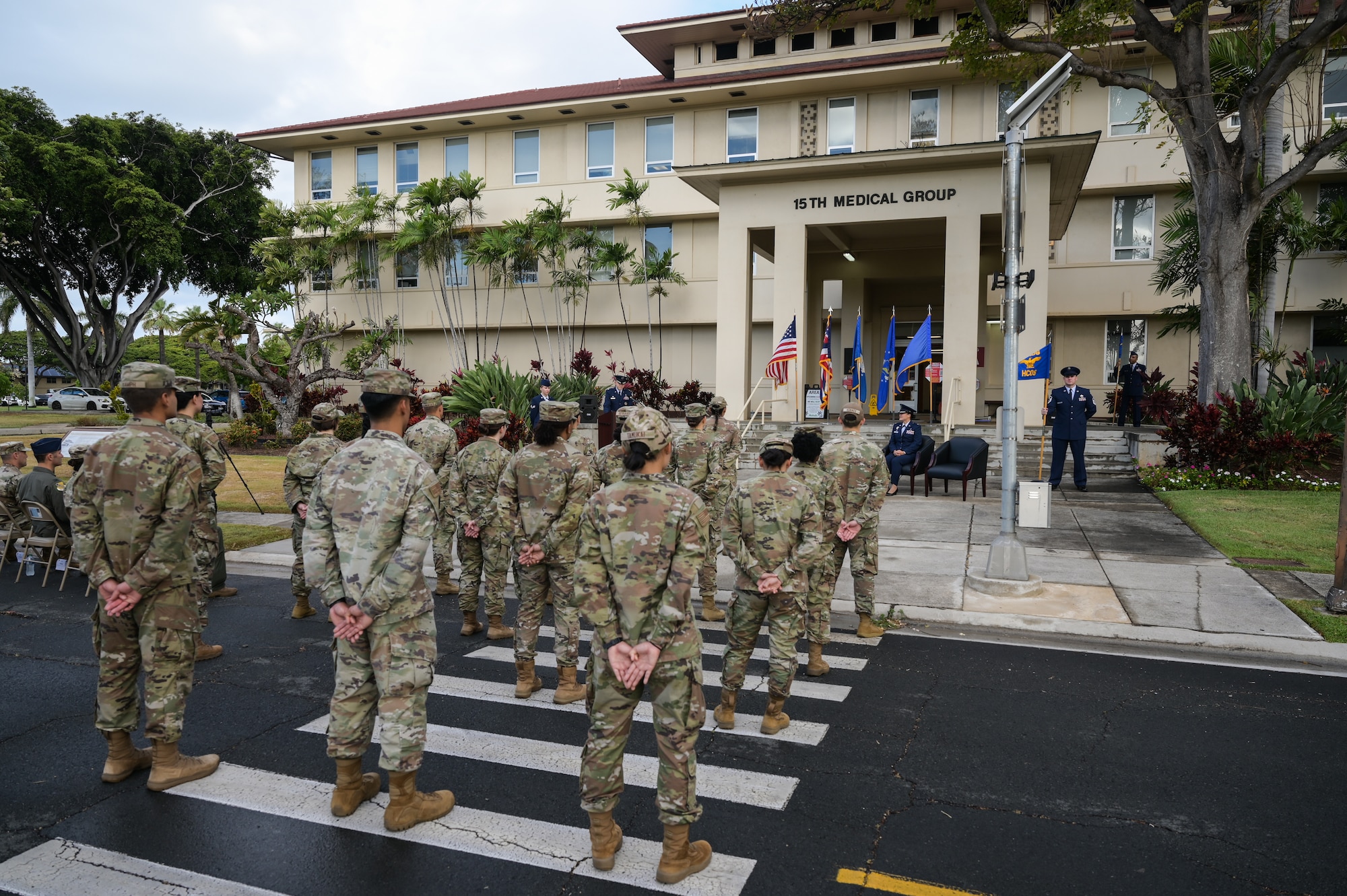 Members of the 15th Healthcare Operations Squadron stand in formation during the 15th HCOS change of command ceremony at Joint Base Pearl Harbor-Hickam, Hawaii, July 21, 2022. Lt. Col. Joseph Sanchez, 15th HCOS commander, accepted the guidon from Col. Stephanie Ku, 15th Medical Group commander, assuming command. (U.S. Air Force photo by Staff Sgt. Alan Ricker)