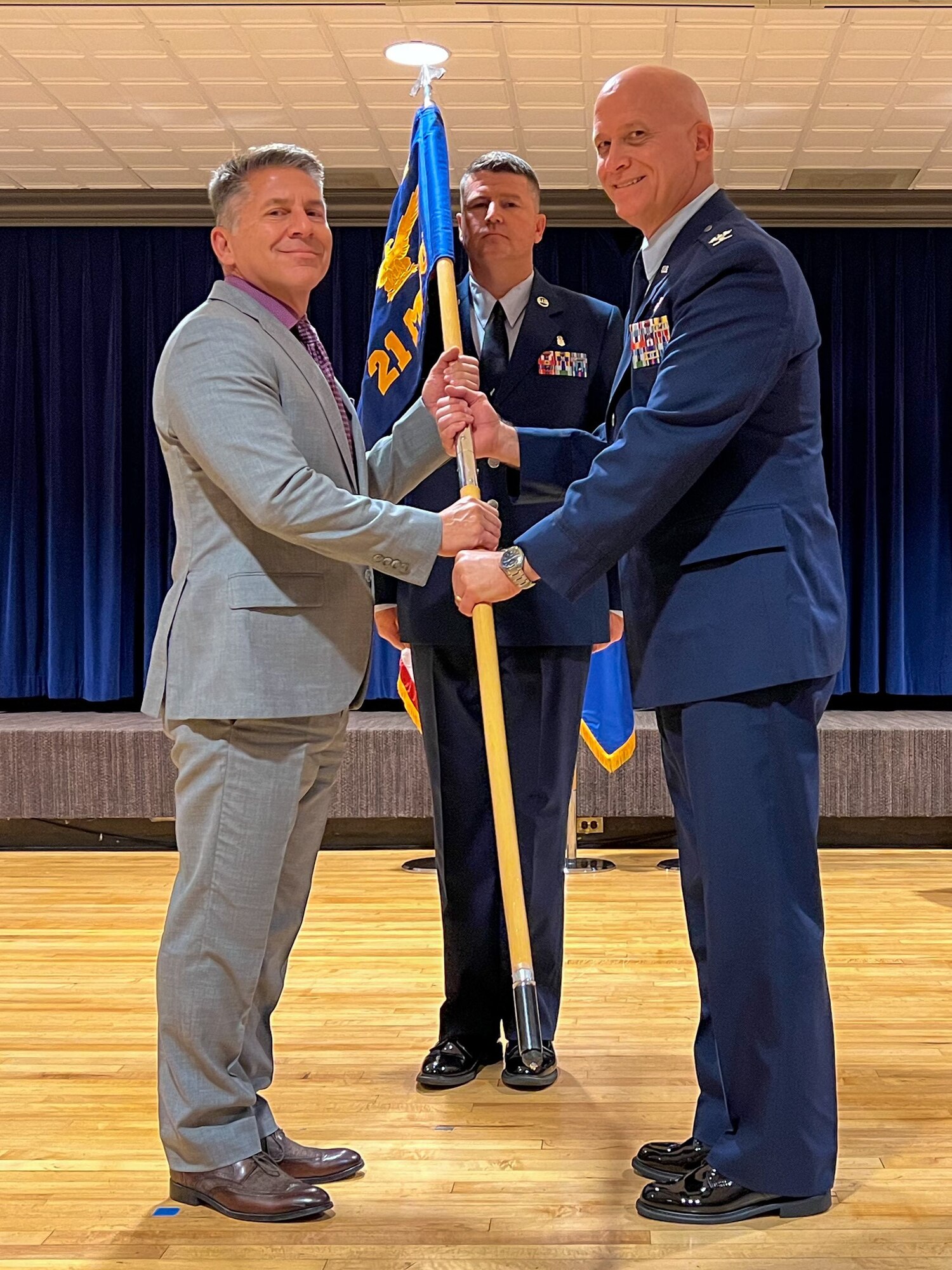 Men hold flag