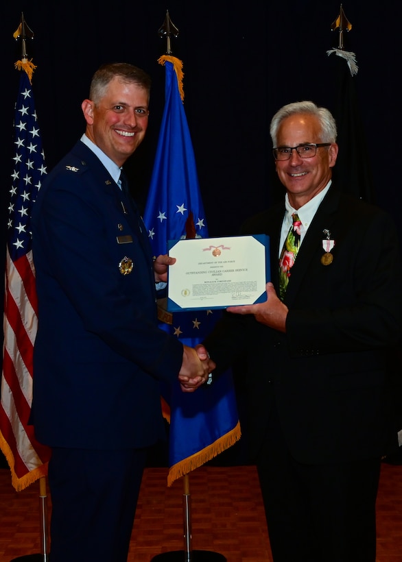 United States Space Force Col. Robert Long, Space Launch Delta 30 commander, presented Ronald B. Cortopassi, 30th Space Wing executive director, received the medal for Outstanding Civilian Career Service at Vandenberg Space Force Base, Calif., July 20, 2022. (U.S. Space Force photo by Airman 1st Class Rocio Romo)