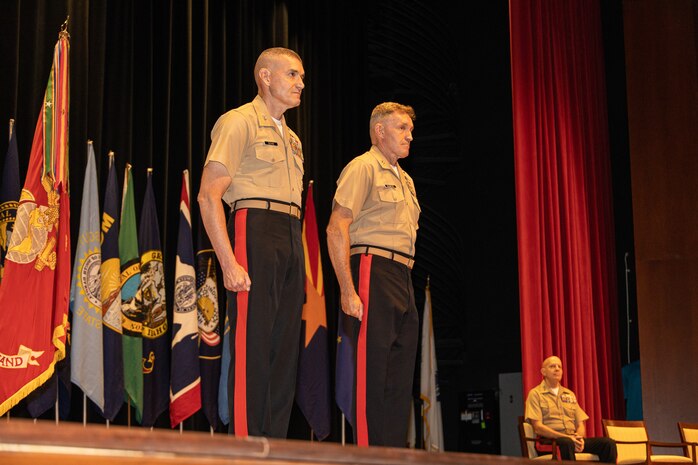 U.S. Marine Corps Maj. Gen. Jason Q. Bohm,  the former commanding general of Marine Corps Recruiting Command, and Maj. Gen. William J. Bowers,  the Commanding General of Marine Corps Recruiting Command, stand at attention during the MCRC change of command ceremony at Marine Corps Base Quantico, Va., on July 21, 2022.