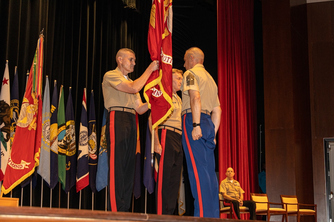 U.S. Marine Corps Maj. Gen. Jason Q. Bohm (left), the former commanding general of Marine Corps Recruiting Command, and Maj. Gen. William J. Bowers (middle) , the commanding general of Marine Corps Recruiting Command, and Sgt. Maj. Adan F. Moreno, the sergeant major of Marine Corps Recruiting Command, perform the passing of colors during the MCRC change of command ceremony at Warner Hall, Marine Corps Base Quantico, Va., on July 21, 2022. Major General Bohm  lead MCRC from July 2020 to July 2022 and will be assuming command as the Inspector General for the Marine Corps. (U.S. Marine Corps photo by Lance Cpl. Gustavo Romero)