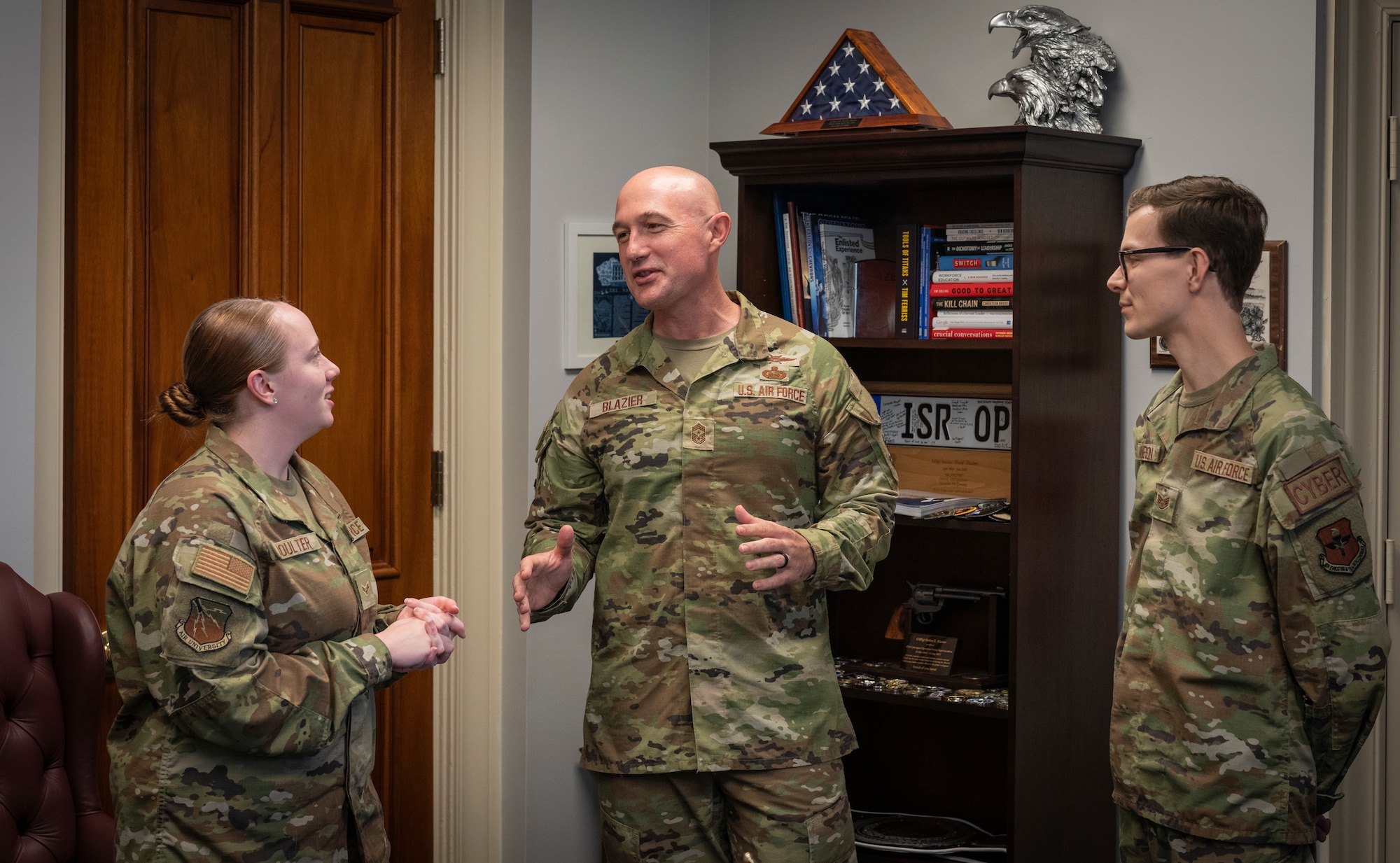 : Air University’s new command chief, Chief Master Sgt. Stefan Blazier, shares a story with some enlisted members in his office July 21, 2022, at Maxwell Air Force Base, Alabama. Blazier arrived at Air University in mid-June following his assignment as chief of Enlisted Force Development at Headquarters U.S. Air Force. The central Florida native was instrumental in the creation of the Enlisted Force Development Action Plan, an aggressive road map for the professional development of the enlisted corps. (U.S. Air Force photo by Airman 1st Class Cody Gandy)