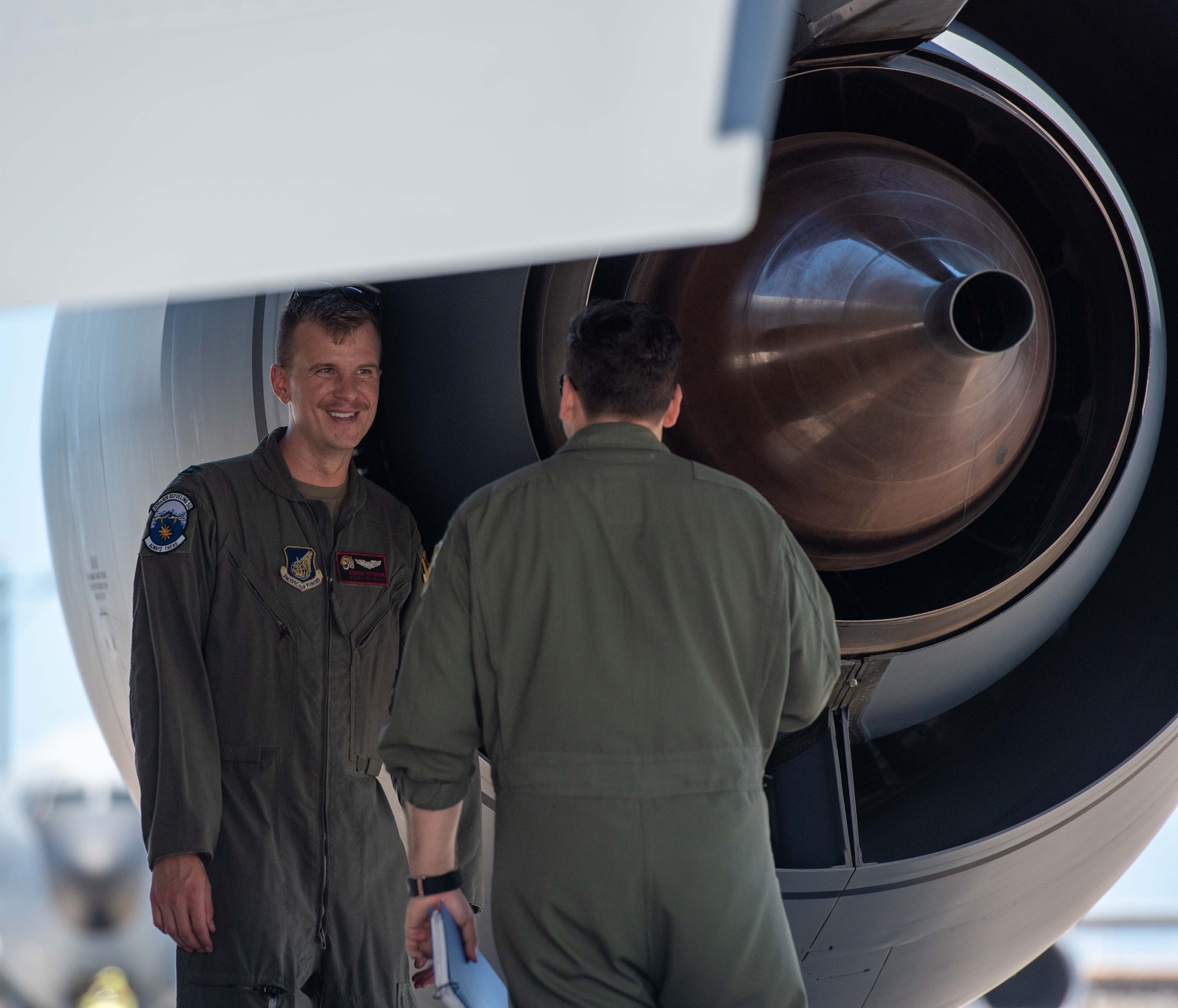 Two pilots inspecting a KC-135 prior to a flight