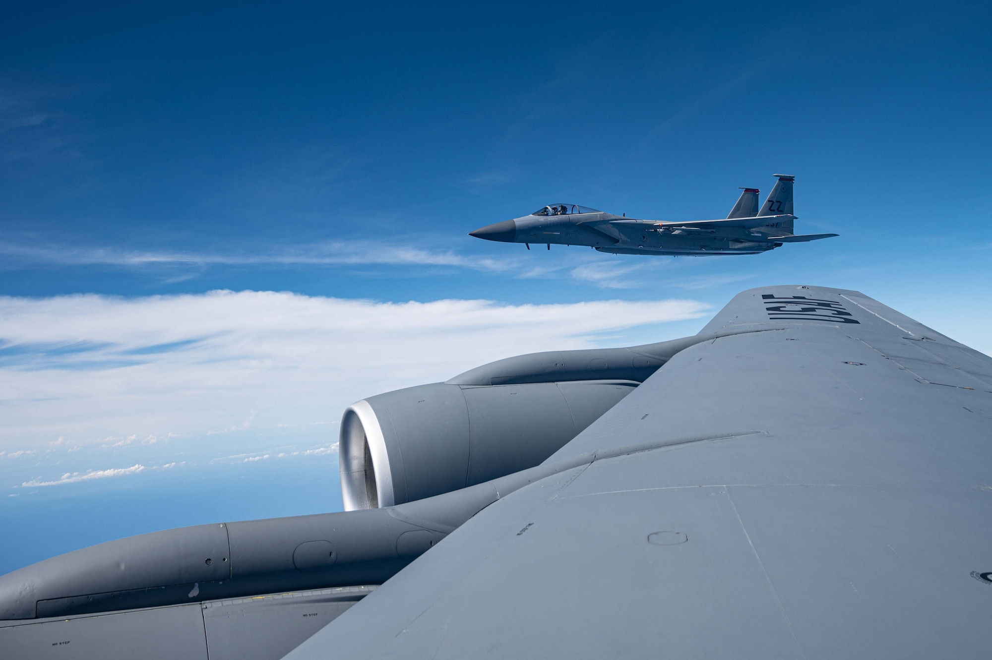One F-15 flies next to a KC-135