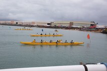 Sri Lankan Marines, participants of the Rim of the Pacific exercise, take part in an all-military canoe race during the John D. Kaupiko Canoe Regatta, Marine Corps Base Hawaii, July 17, 2022. MCBH hosted the canoe regatta in conjunction with the Hui Nalu Canoe Club, as an opportunity to foster relations between the base and the local community. MCBH previously hosted the event in 2014, 2015, 2017 and 2019. (U.S. Marine Corps photo by Lance Cpl. Chandler Stacy)