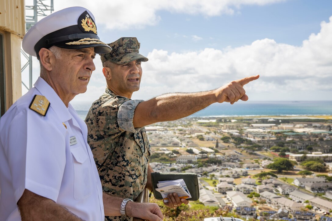 U.S. Marine Corps Col. Speros Koumparakis, right, commanding officer, Marine Corps Base Hawaii, points Commander-in-Chief of the Chilean Navy Adm. Juan Andres de la Maza to the Rim of the Pacific locations aboard MCBH, July 20, 2022. The purpose of the visit was to brief de la Maza on Chile’s participation and role during Rim of the Pacific 2022. (U.S. Marine Corps photo by Cpl. Samantha Sanchez)