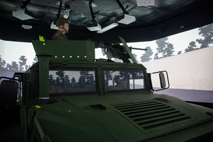 U.S. Navy Hospital Corpsmen with Bravo Surgical Company, 3d Medical Battalion, survey the surrounding area for hostiles during a convoy simulation, Marine Corps Base Hawaii, July 19, 2022. The purpose of the training was to familiarize hospital corpsmen on their additional duties when assigned to an operational unit, increasing readiness and proficiency. (U.S. Marine Corps photo by Cpl. Samantha Sanchez)