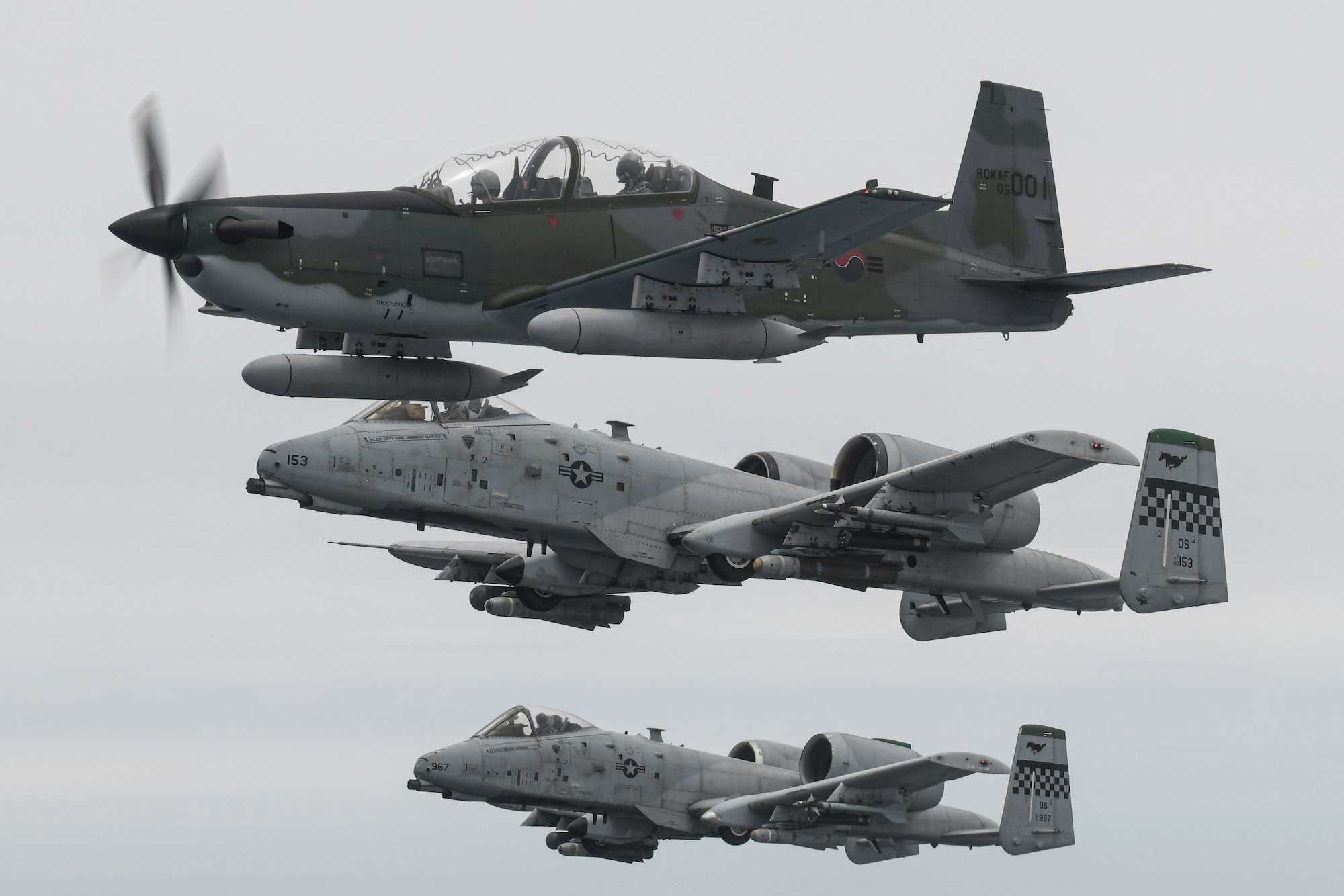 A Republic of Korea Air Force KA-1 Woongbi assigned to the 237th Fighter Squadron flies alongside two 25th Fighter Squadron A-10 Thunderbolt IIs during Buddy Squadron 22-5