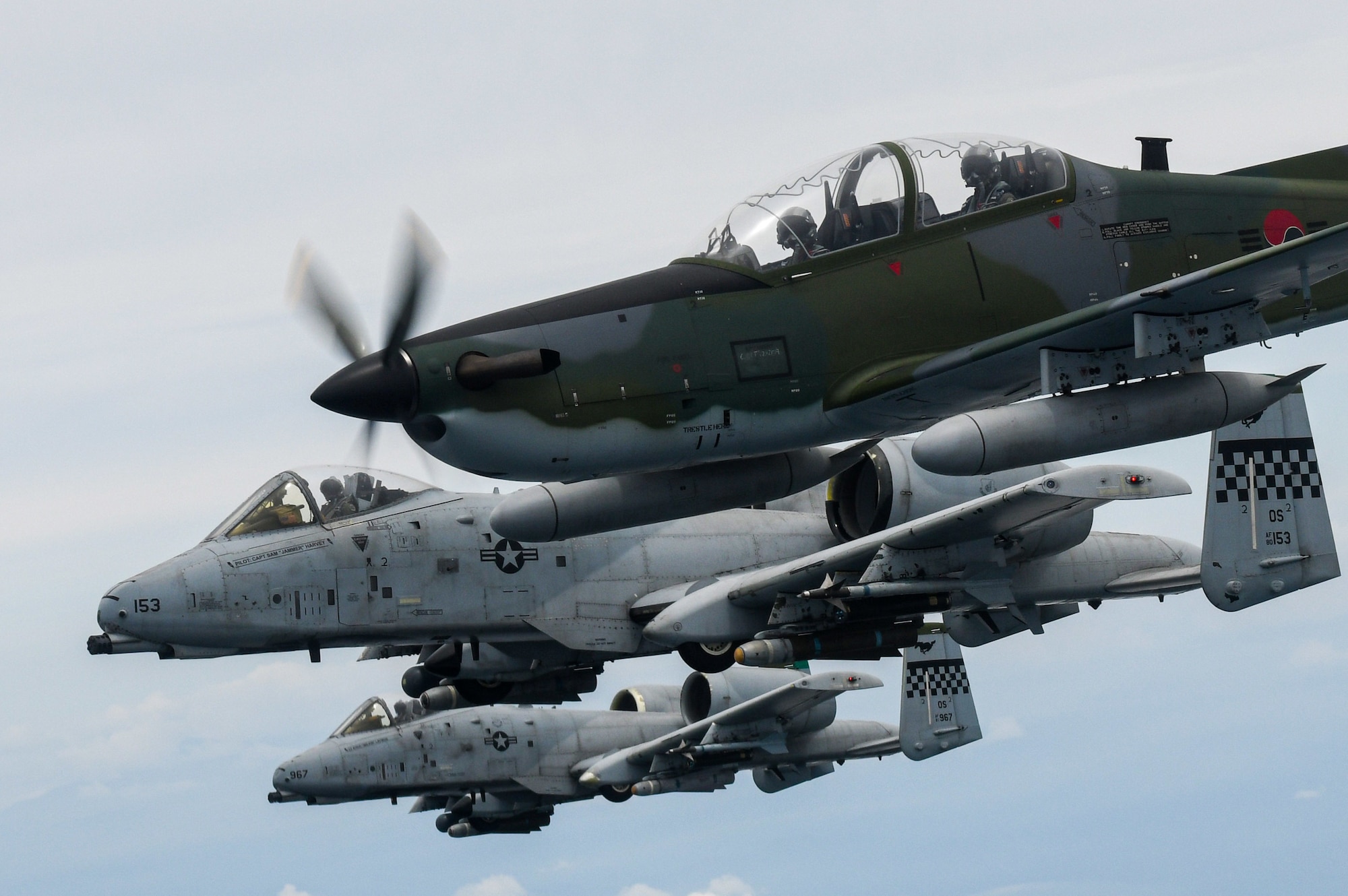 A Republic of Korea Air Force KA-1 Woongbi assigned to the 237th Fighter Squadron flies alongside two 25th Fighter Squadron A-10 Thunderbolt IIs during Buddy Squadron 22-5