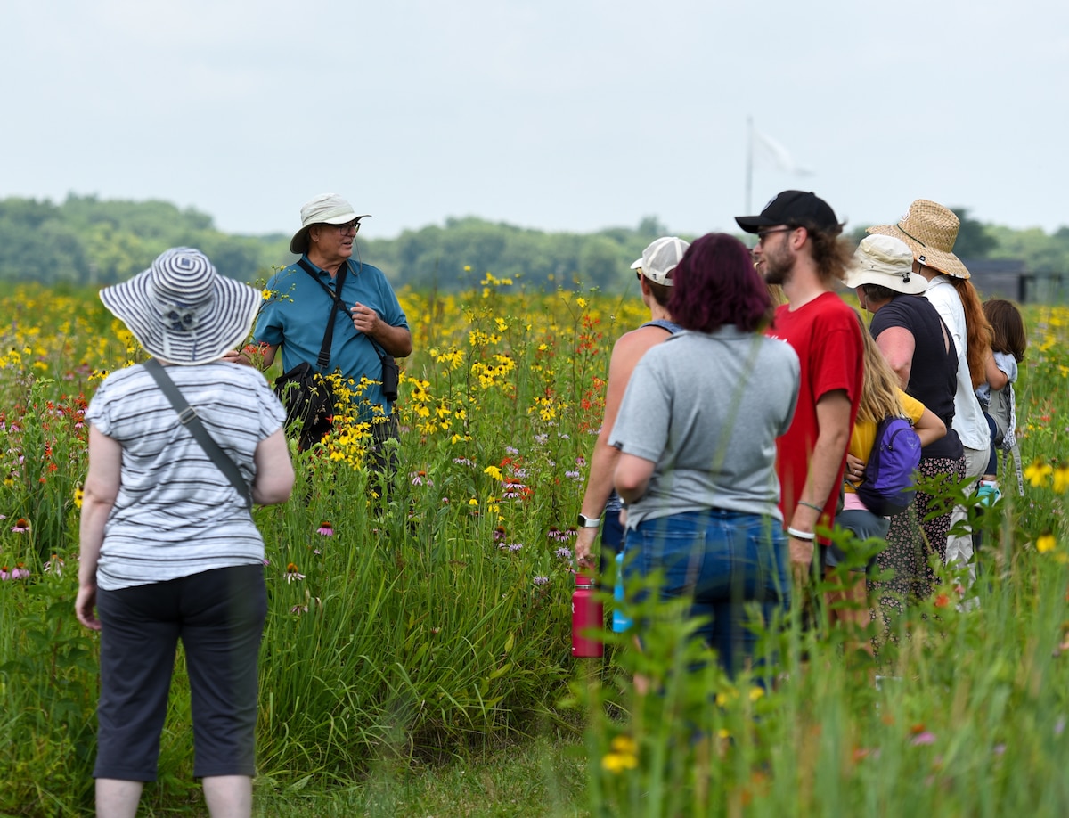 Dave Nolin, retired director of Five Rivers MetroParks, gives an informative walking tour to more than a dozen visitors to Huffman Prairie, which features over 300 species of wildflowers, Wright-Patterson Air Force Base, Ohio, July 20, 2022. Huffman Prairie is the largest natural tallgrass prairie in Ohio.