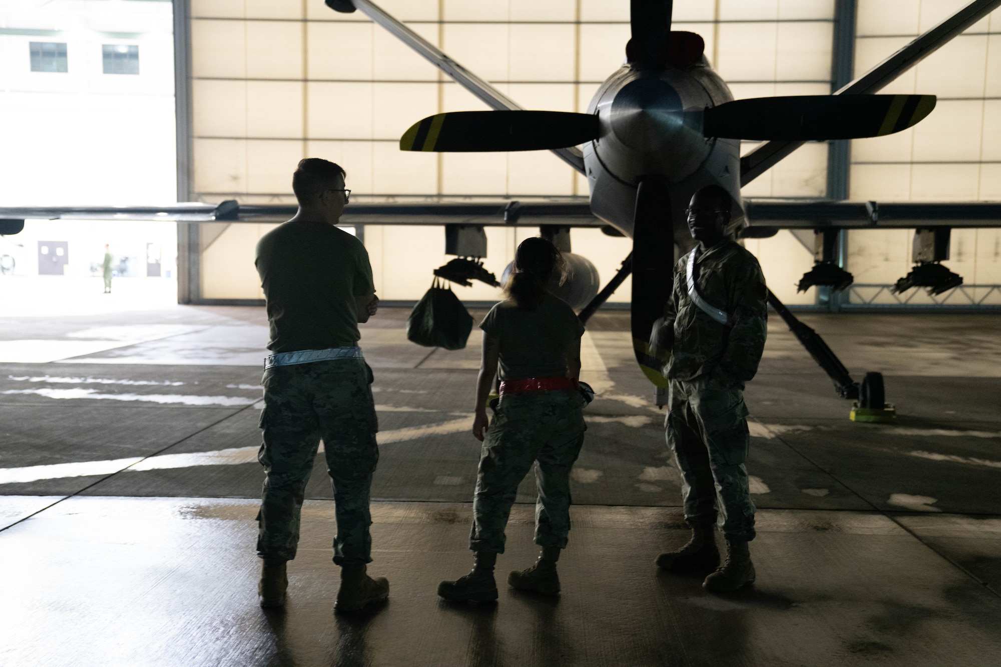 MARINE CORPS BASE HAWAII, Hawaii (July 13, 2022) - U.S. Air Force maintenance specialists, assigned to the 29th Air Maintenance Unit, survey the MQ-9A Reaper at Marine Corps Air Station Kaneohe Bay during Rim of the Pacific (RIMPAC) 2022, July 13. Unmanned and remotely operated vessels extend the capability of interconnected manned platform sensors to enhance the warfighting capacity of multinational joint task forces. Twenty-six nations, 38 ships, four submarines, more than 170 aircraft and 25,000 personnel are participating in RIMPAC from June 29 to Aug. 4 in and around the Hawaiian Islands and Southern California. The world's largest international maritime exercise, RIMPAC provides a unique training opportunity while fostering and sustaining cooperative relationships among participants critical to ensuring the safety of sea lanes and security on the world's oceans. RIMPAC 2022 is the 28th exercise in the series that began in 1971. (U.S. Air Force photo by Airman 1st Class Ariel O'Shea)