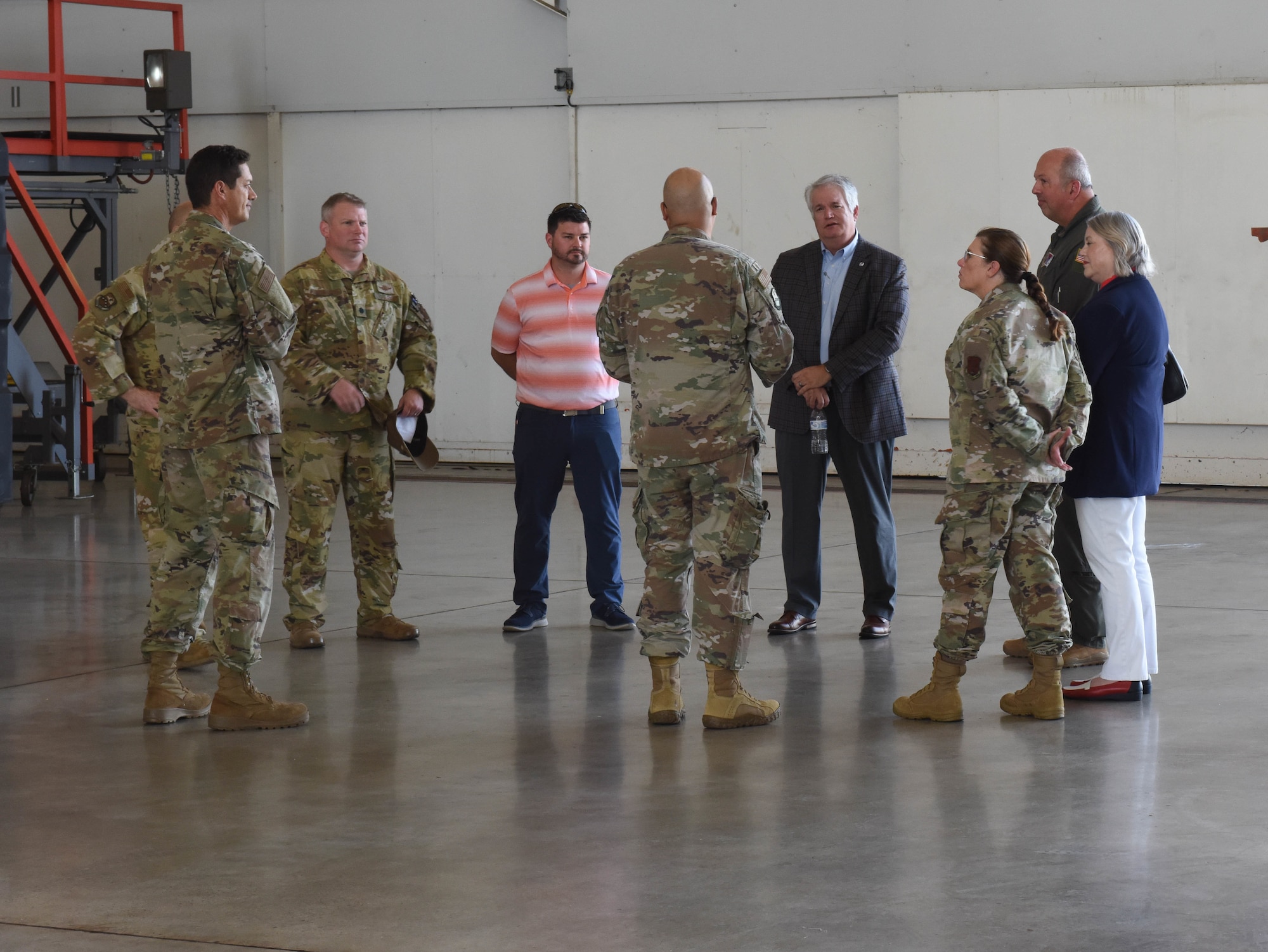 Honorary Commanders of the 189th Airlift Wing, John Burgess, David Valovich, and Dr. Angela Kremers are briefed leadership by leadership of the 189th Maintenance Group at Little Rock Air Force Base, Arkansas, July 19, 2022. The Honorary Wing Commander program is designed to engage community leaders in the military lifestyle and educate them about the responsibilities of airmen who are hired, supported, and served on a daily basis. (Air National Guard photo by Airman 1st Class Samuel Zang)