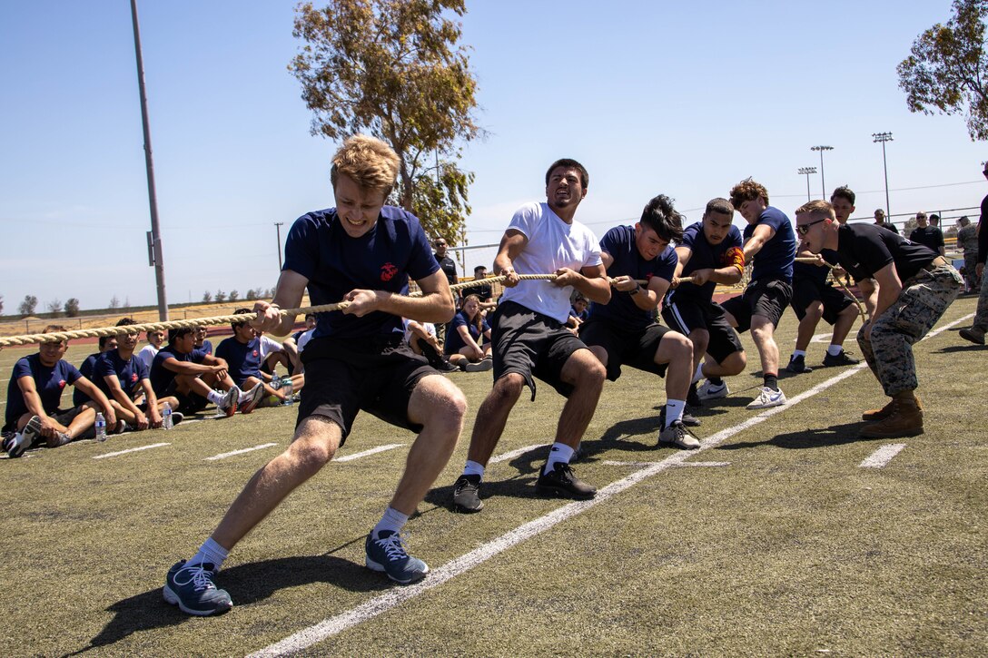 Future Marines with Recruiting Station Sacramento participate in the tug of war during a monthly pool function at Naval Air Station Lemoore in Lemoore, California, May 7, 2022. Pool functions are designed for future Marines to build camaraderie, improve fitness and learn leadership skills in preparation for recruit training. (U.S. Marine Corps photo by Cpl. Seaira Moore)