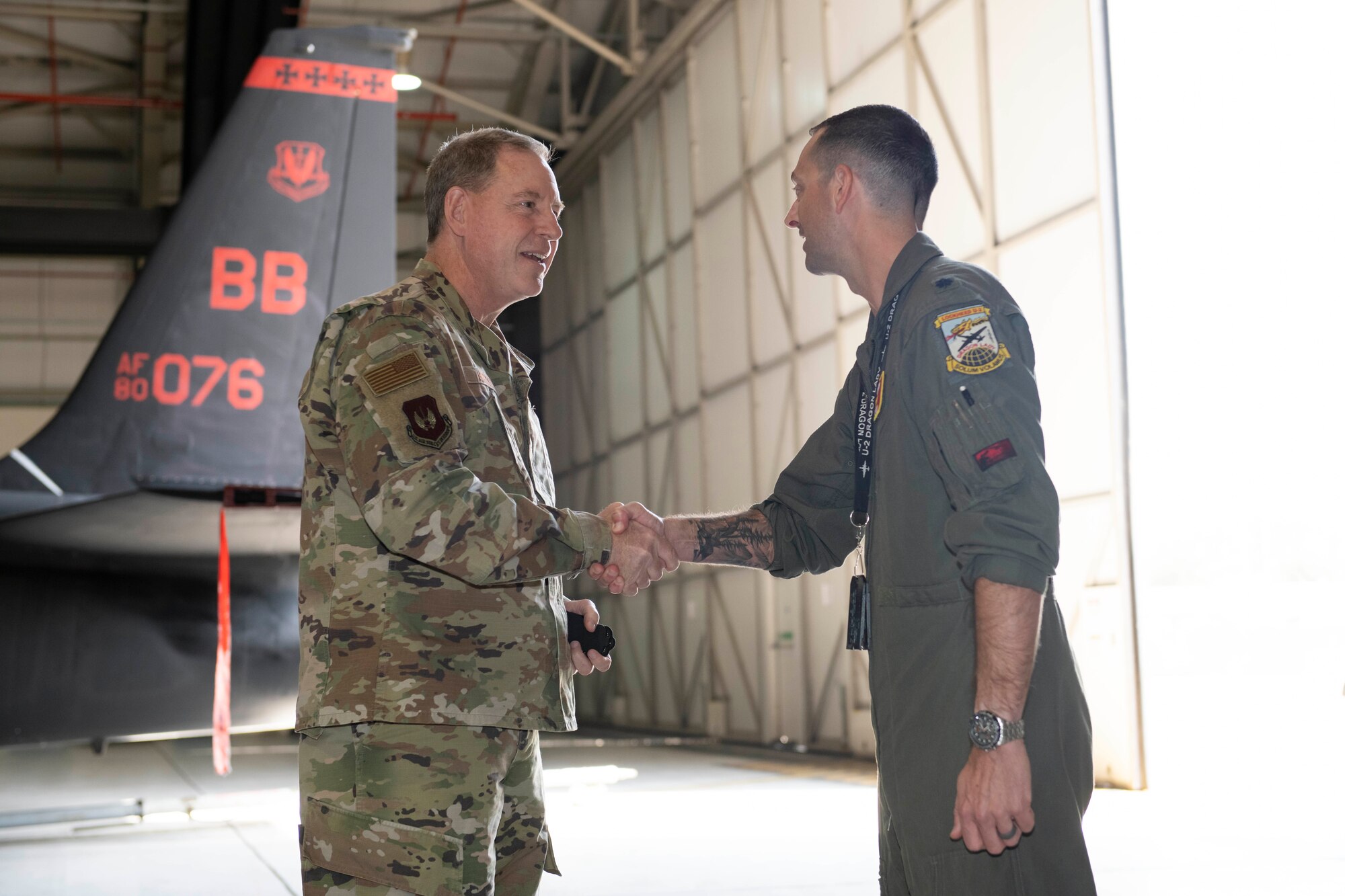 U.S. Air Force Gen. James B. Hecker, left, U.S. Air Forces in Europe and Air Forces Africa commander, recognizes Lt. Col. Christopher “Scrat” Pridgen, right, 99th Expeditionary Reconnaissance Squadron director of operations, at Royal Air Force Fairford, England, July, 18, 2022. During his first visit to the 501st Combat Support Wing  as the USAFE-AFAFRICA commander, Hecker met with several Airmen and received briefings about the wing’s mission and capabilities. (U.S. Air Force photo by Senior Airman Jennifer Zima)