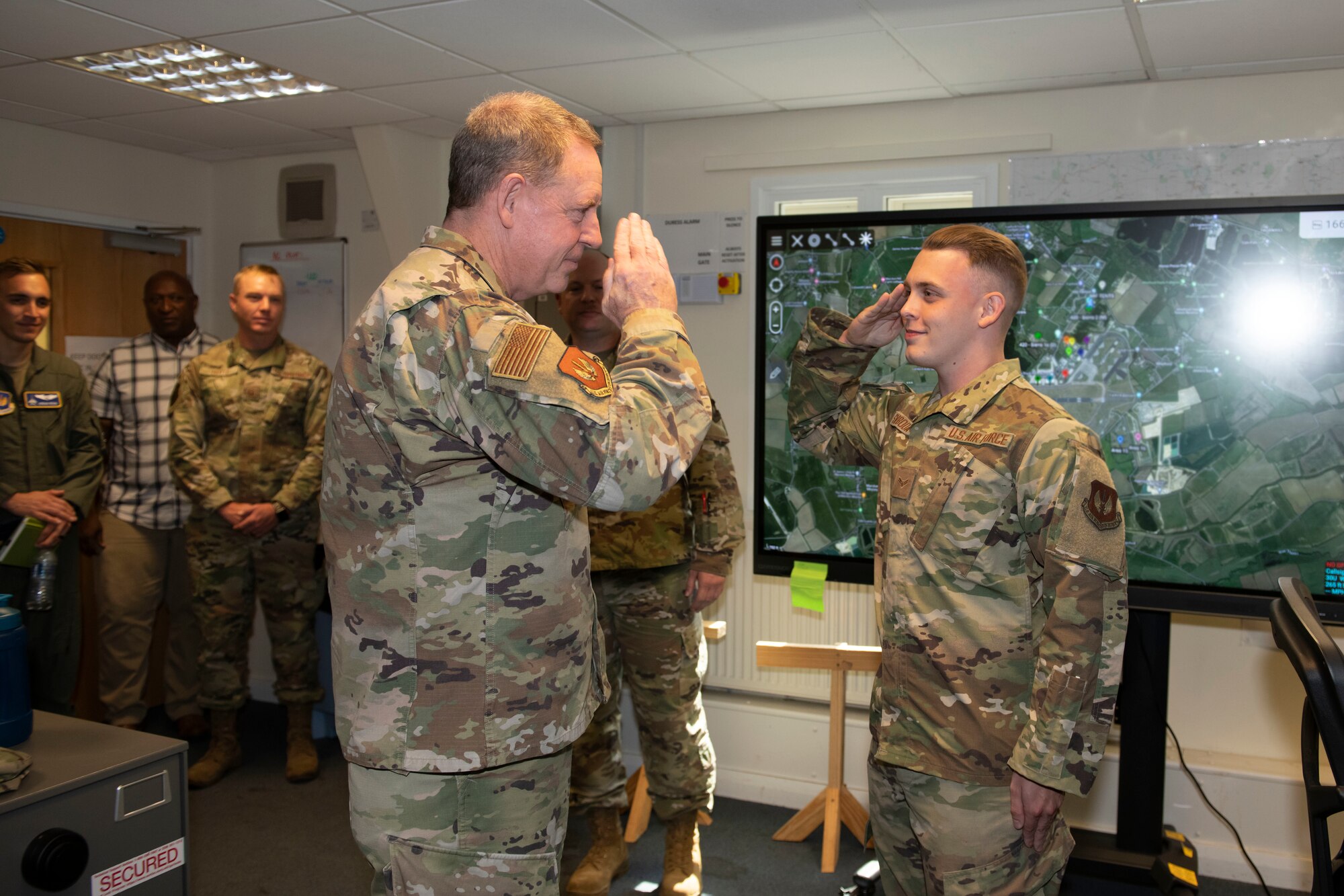 U.S. Air Force Gen. James B. Hecker, left, U.S. Air Forces in Europe and Air Forces Africa commander, recognizes Airman 1st Class Joshua Svoboda, right, 420th Expeditionary Air Base Squadron water and fuel systems apprentice, at Royal Air Force Fairford, England, July, 18, 2022. During his first visit to the 501st Combat Support Wing as the USAFE-AFAFRICA commander, Hecker met with several Airmen and received briefings about the wing’s mission and capabilities. (U.S. Air Force photo by Senior Airman Jennifer Zima)