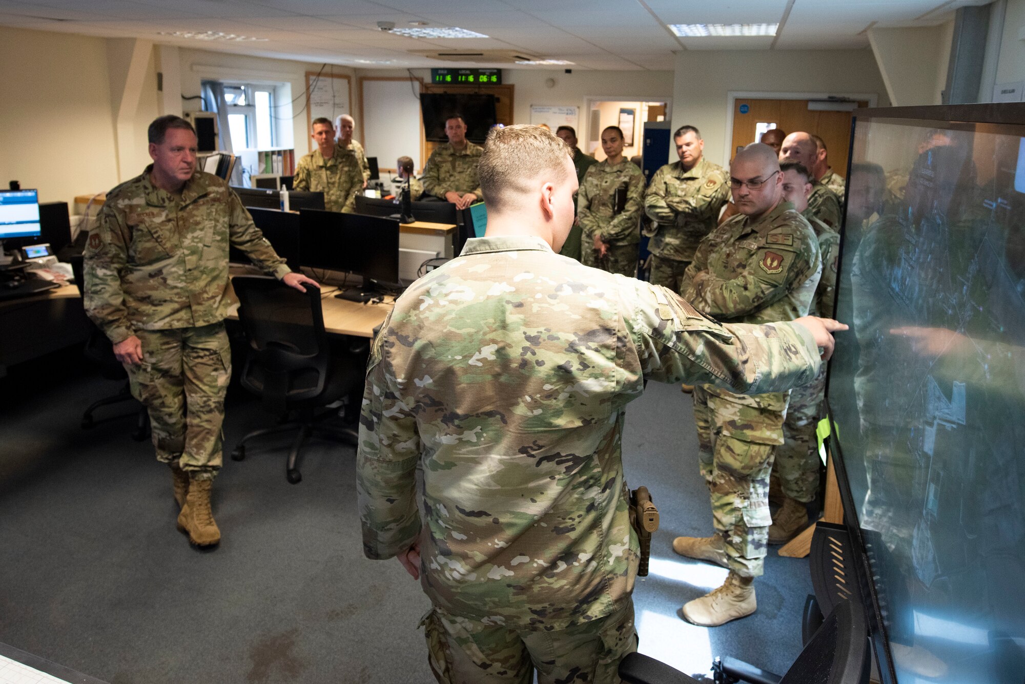 U.S. Air Force Staff Sgt. Bryson Carte, right, 420th Air Base Squadron security forces base defense operations center controller, briefs Gen. James B. Hecker, left, U.S. Air Forces in Europe and Air Forces Africa commander, about base security at Royal Air Force Fairford, England, July, 18, 2022. During his first visit to the 501st Combat Support Wing as the USAFE-AFAFRICA commander, Hecker met with several Airmen and received briefings about the wing’s mission and capabilities. (U.S. Air Force photo by Senior Airman Jennifer Zima)