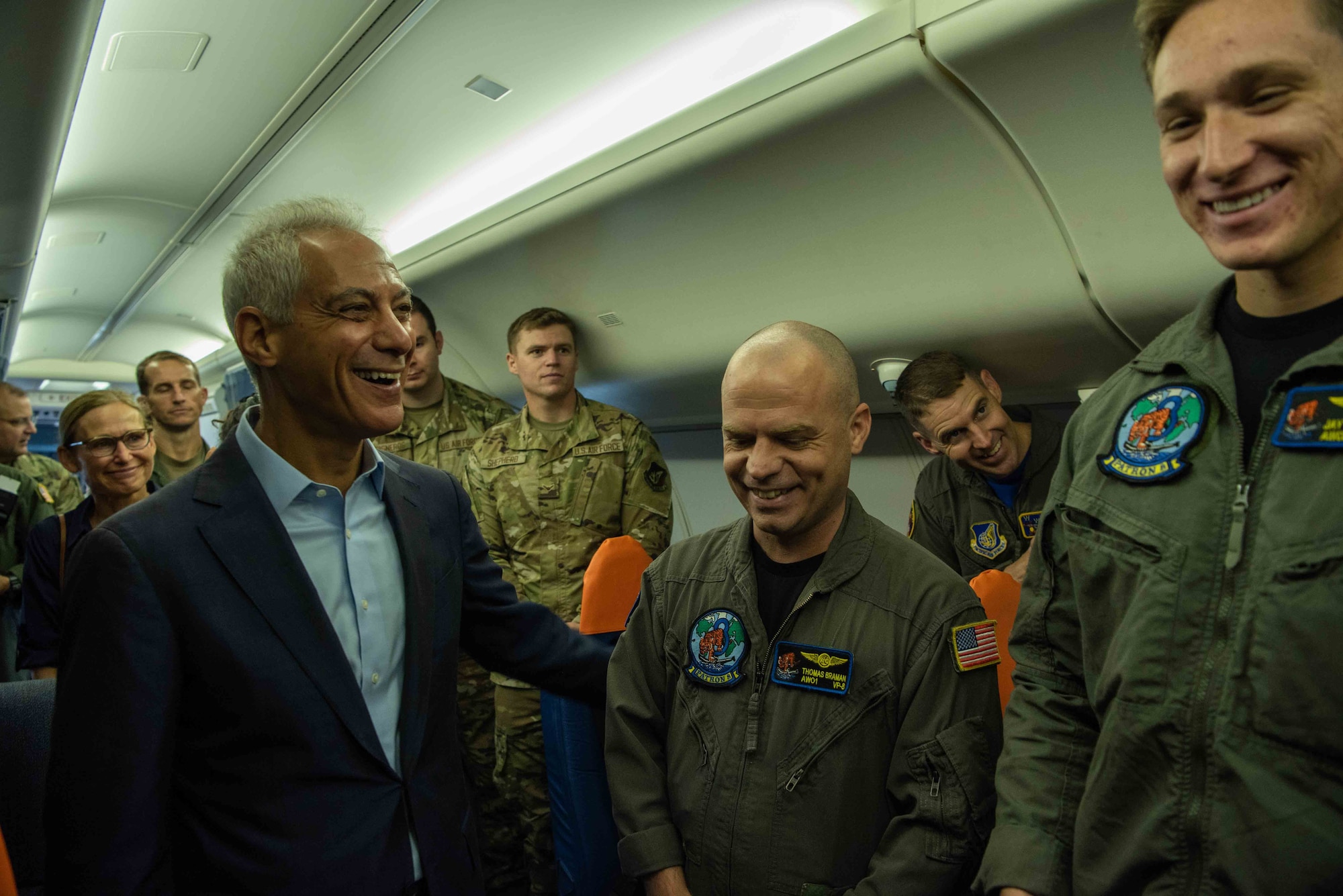 Rahm Emanuel, left, U.S. Ambassador to Japan, laughs with U.S. Navy Sailors during the ambassadors visit at Misawa Air Base, Japan, July 22, 2022.