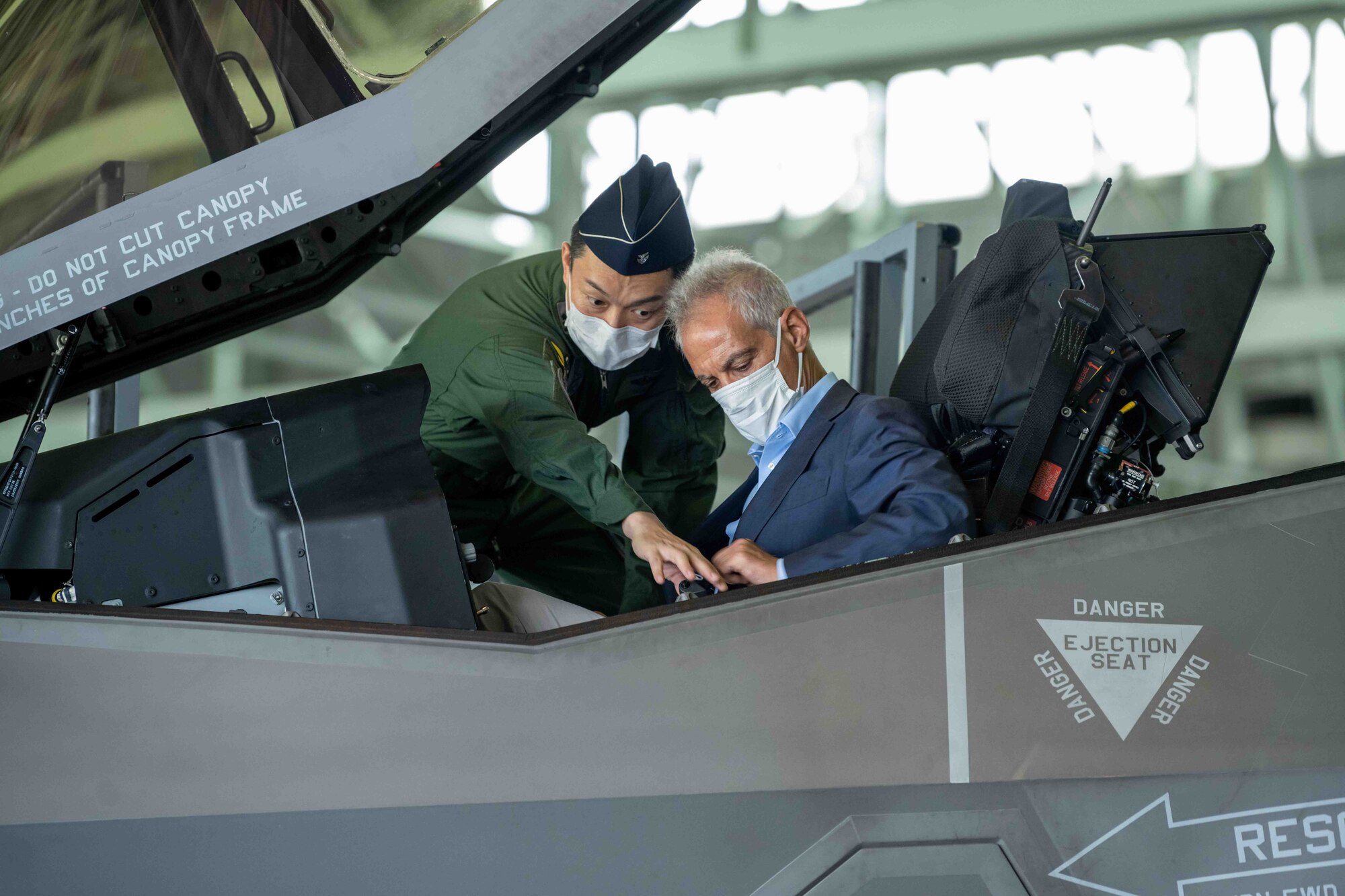 Maj. Gen. Takahiro Kubota, left, 3rd Air Wing and Japan Air Self-Defense Force (JASDF) Misawa Air Base commander, shows Rahm Emanuel, right, U.S. Ambassador to Japan, a JASDF F-35A Lightning II Joint Strike Fighter during the ambassador’s visit at Misawa Air Base, Japan, July 22, 2022.