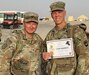 U.S. Army Sgt. 1st Class Michael Marra, left, and Sgt. 1st Class Sean Foley, with the 1067th Composite Truck Company, are all smiles after successfully completing the Danish Contingent (DANCON) march. This 25 km ruck march began in 1972 and remains a traditional event to foster the partnership between Danish forces and their allies. 250 Soldiers with the 1067th CTC participated, with proceeds gathered from registrations donated to the Danish Wounded Warriors Project. (U.S. Army photo by 1st Lt. Michael Demboski)