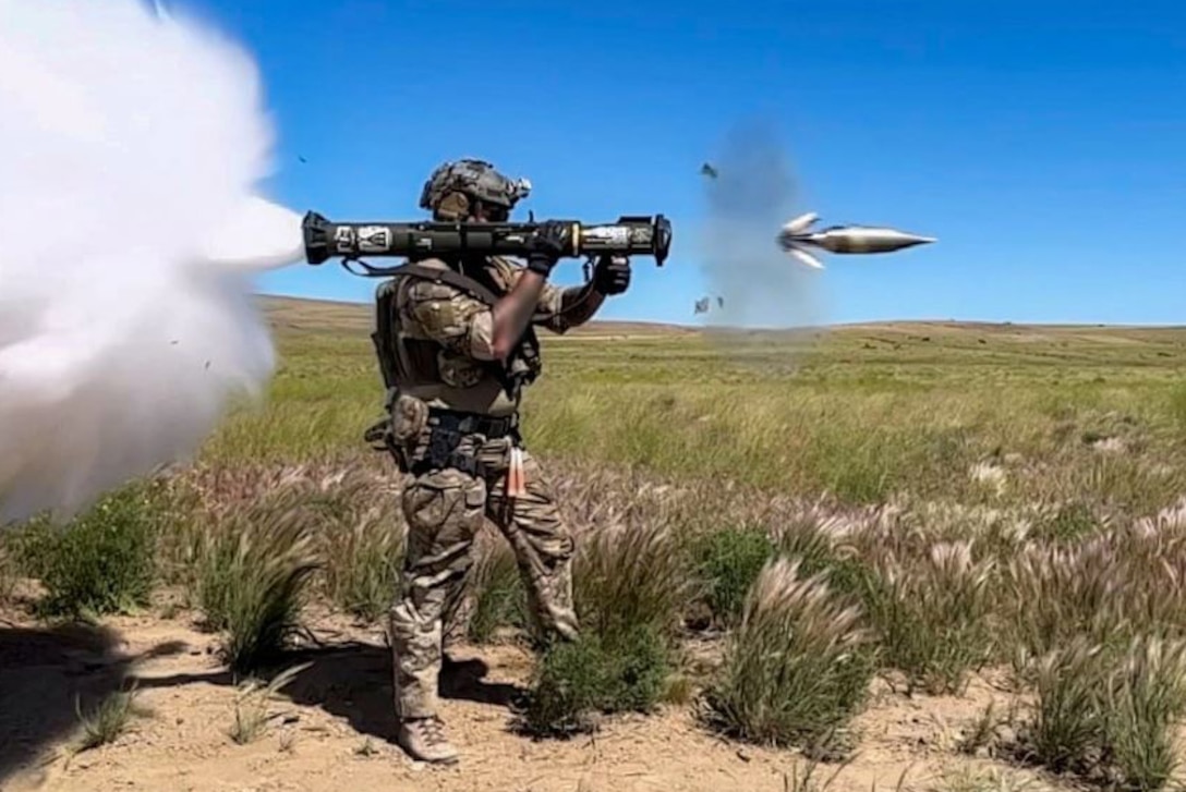 A soldier fires a weapon.