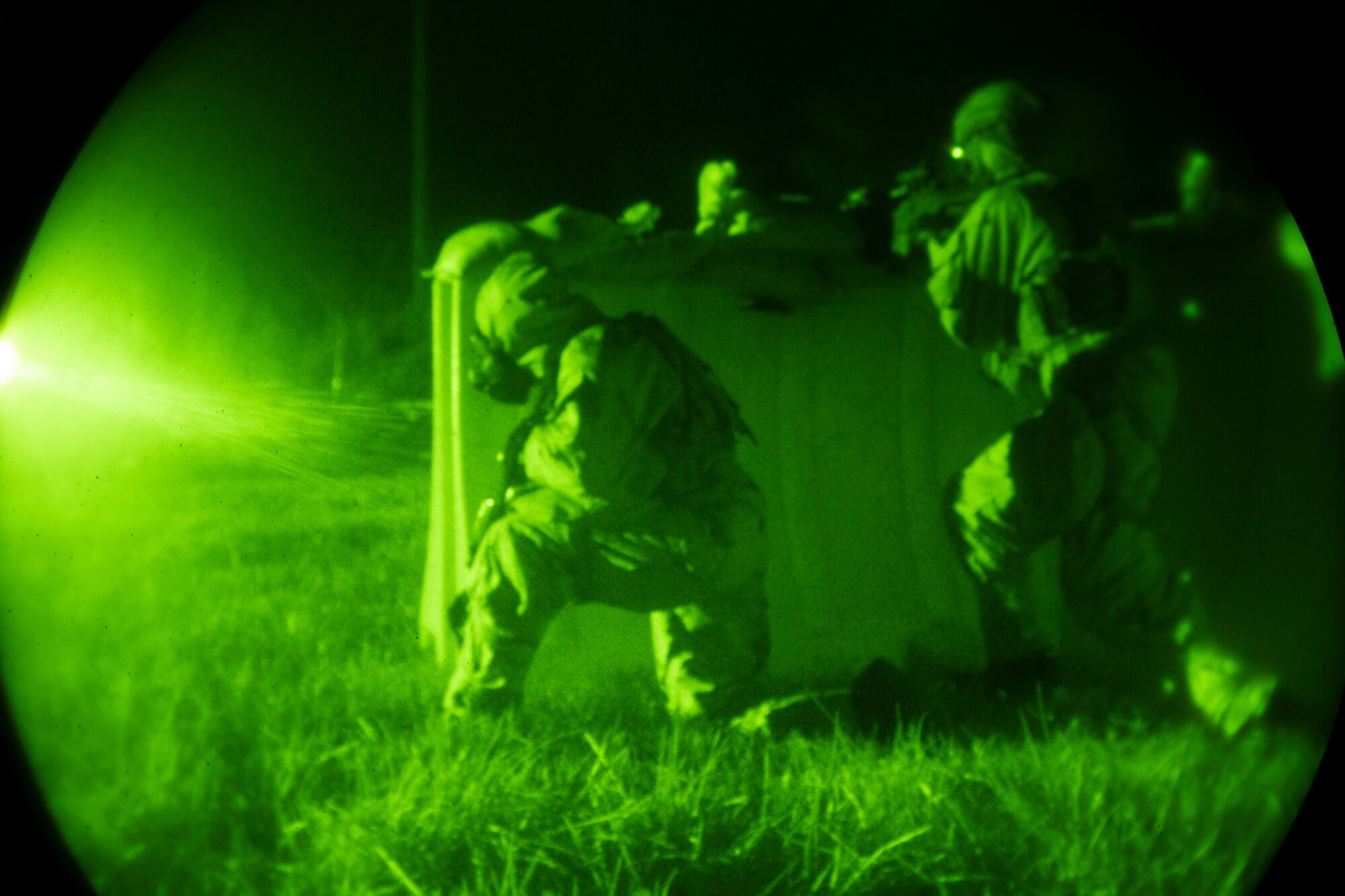 Members from the 512th and 436th security forces squadrons defend themselves against a simulated enemy attack during the Liberty Eagle Readiness Exercise at Dover Air Force Base, Delaware, July 14, 2022. Reserve Citizen Airmen from the 512th Airlift Wing and active-duty Airmen from the 436th Airlift Wing demonstrated their combat capabilities while wearing mission oriented protective posture gear at a simulated forward operating base, located on Dover AFB, July 11-15, 2022. The purpose of this exercise was to validate both wings' ability to generate, employ and sustain airpower across the world in a contested and degraded operational environment. (U.S. Air Force photo by Senior Airman Ruben Rios)