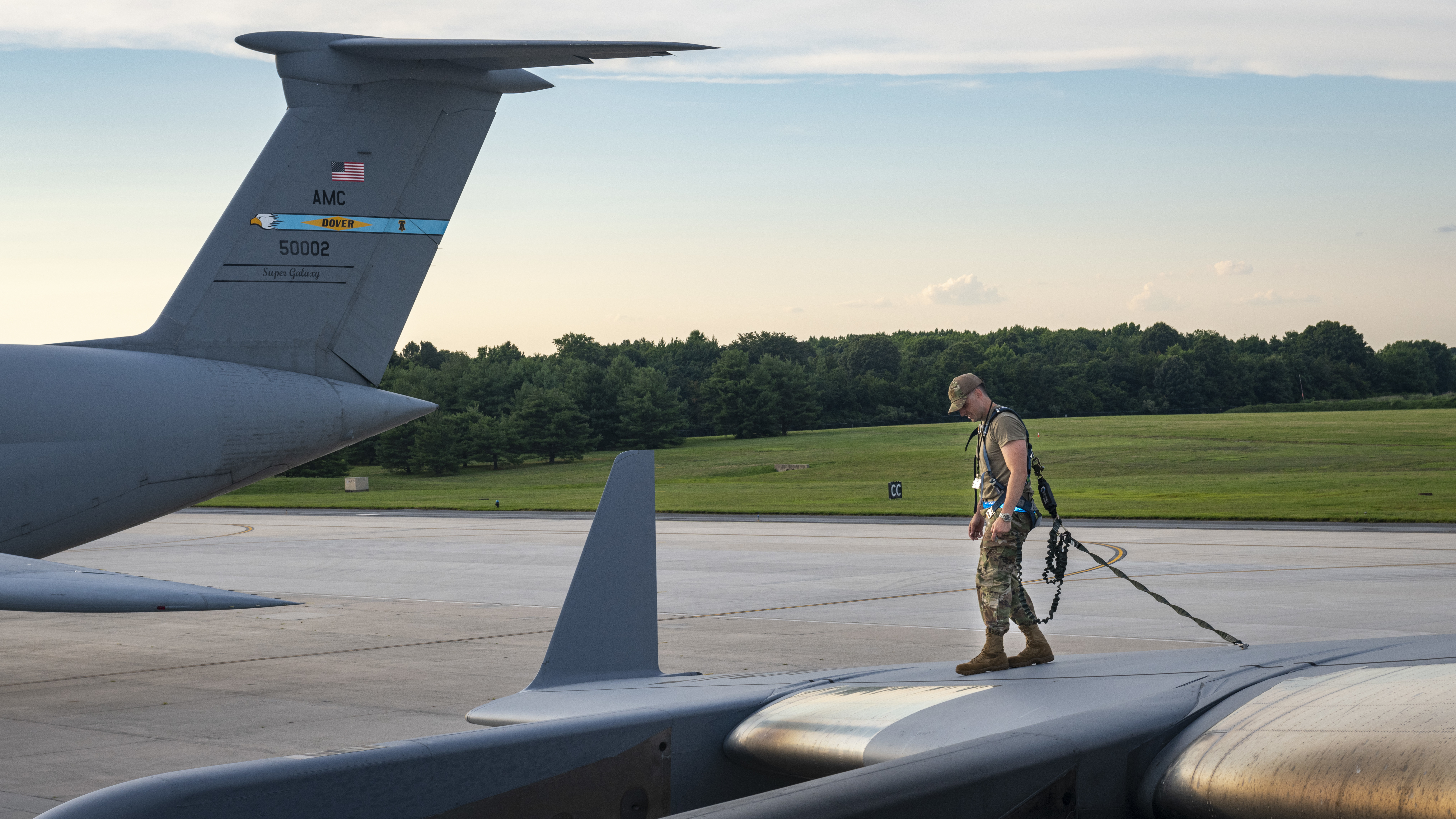 U.S. Air Force Tech. Sgt. Colin McCready, 712th Aircraft Maintenance Squadron maintainer, inspects the wing of a C-17 Globemaster III during the Liberty Eagle Readiness Exercise at Dover Air Force Base, Delaware, July 15, 2022. McCready is one of many maintainers from the 512th and 436th airlift wings who worked together during a simulated deployment to a forward operating base, located on Dover AFB, July 11-15, 2022. The purpose of this exercise was to validate both wings' ability to generate, employ and sustain airpower across the world in a contested and degraded operational environment. (U.S. Air Force photo by Senior Airman Ruben Rios)