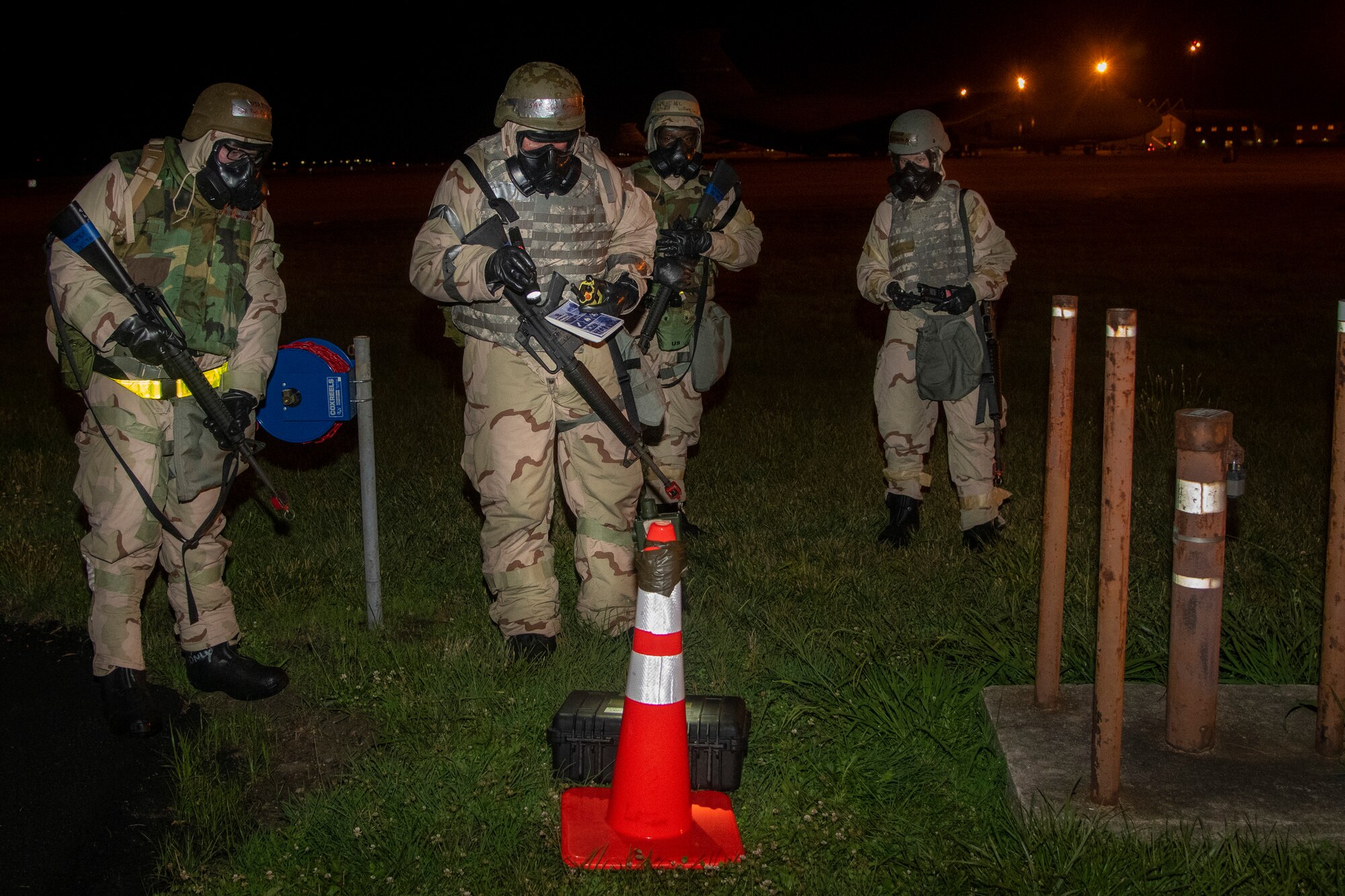 Airmen from the 436th Civil Engineer Squadron and 436th Logistics Readiness Squadron conduct post attack reconnaissance sweeps during the Liberty Eagle Readiness Exercise at Dover Air Force Base, Delaware, July 15, 2022. These Airmen demonstrated their ability to search for hazards such as unexploded ordnance, chemical agents and facility damage while wearing mission oriented protective posture gear at a forward operating base, located on Dover AFB, July 11-15, 2022. The purpose of this exercise is to validate the 512th and 436th airlift wings' ability to generate, employ and sustain airpower across the world in a contested and degraded operational environment. (U.S. Air Force photo by Senior Airman Ruben Rios)