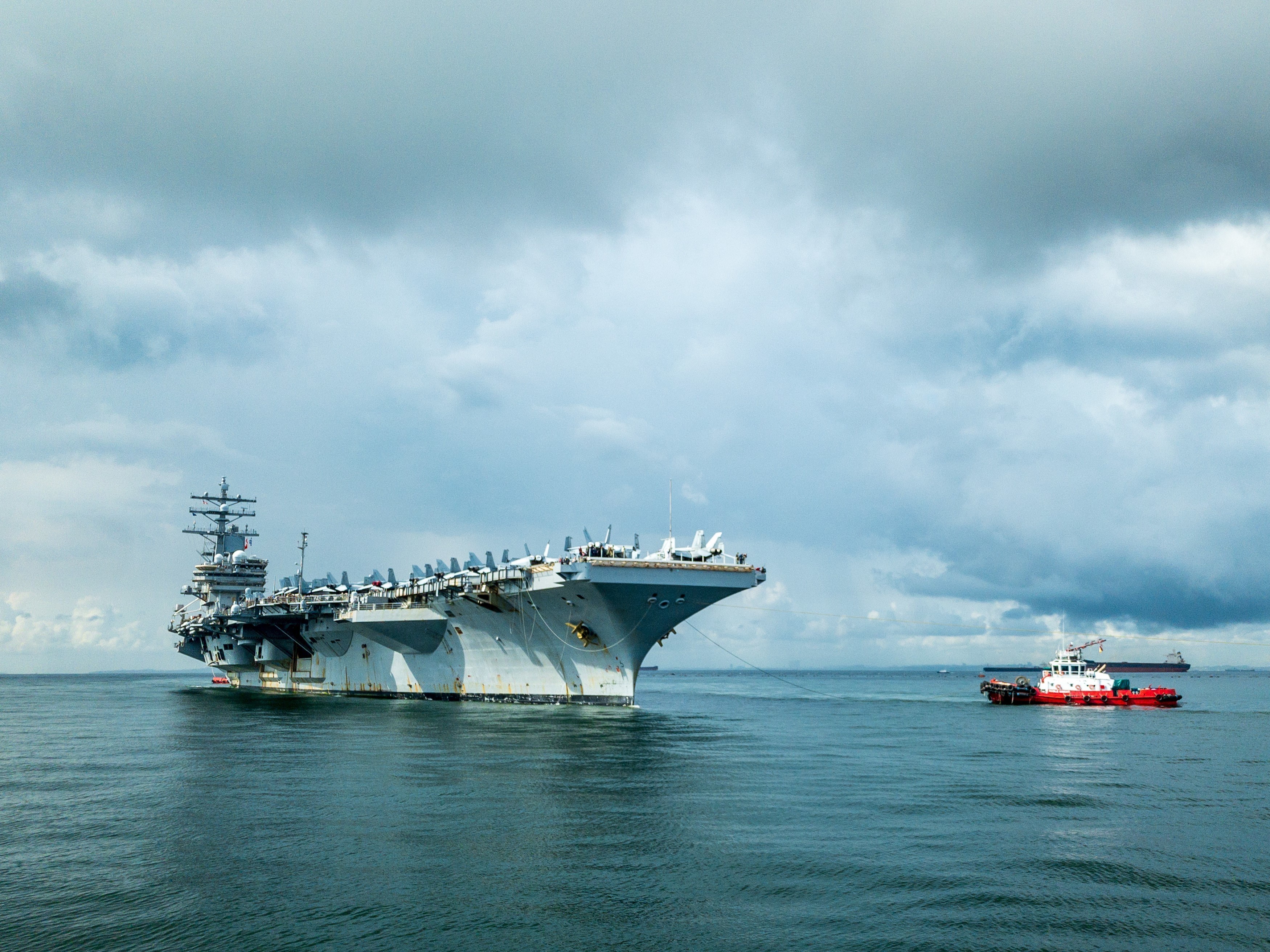 The U.S. Navy’s only forward-deployed aircraft carrier USS Ronald Reagan (CVN 76), pulls in to Changi Naval Base, Singapore for a scheduled port visit.