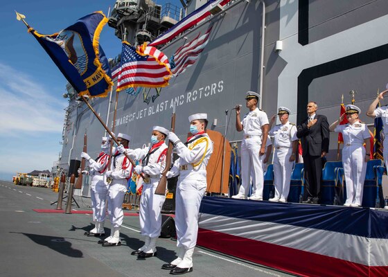 Lt. Jarred Reid-Dixon sings the National Anthem during the Commander Amphibious Squadron SEVEN (CPR 7) change of command and reitrement ceremony for Capt. Jennifer Ellinger, offgoing Commodore of CPR 7, aboard amphibious assault ship USS Makin Island (LHD 8), July 21.