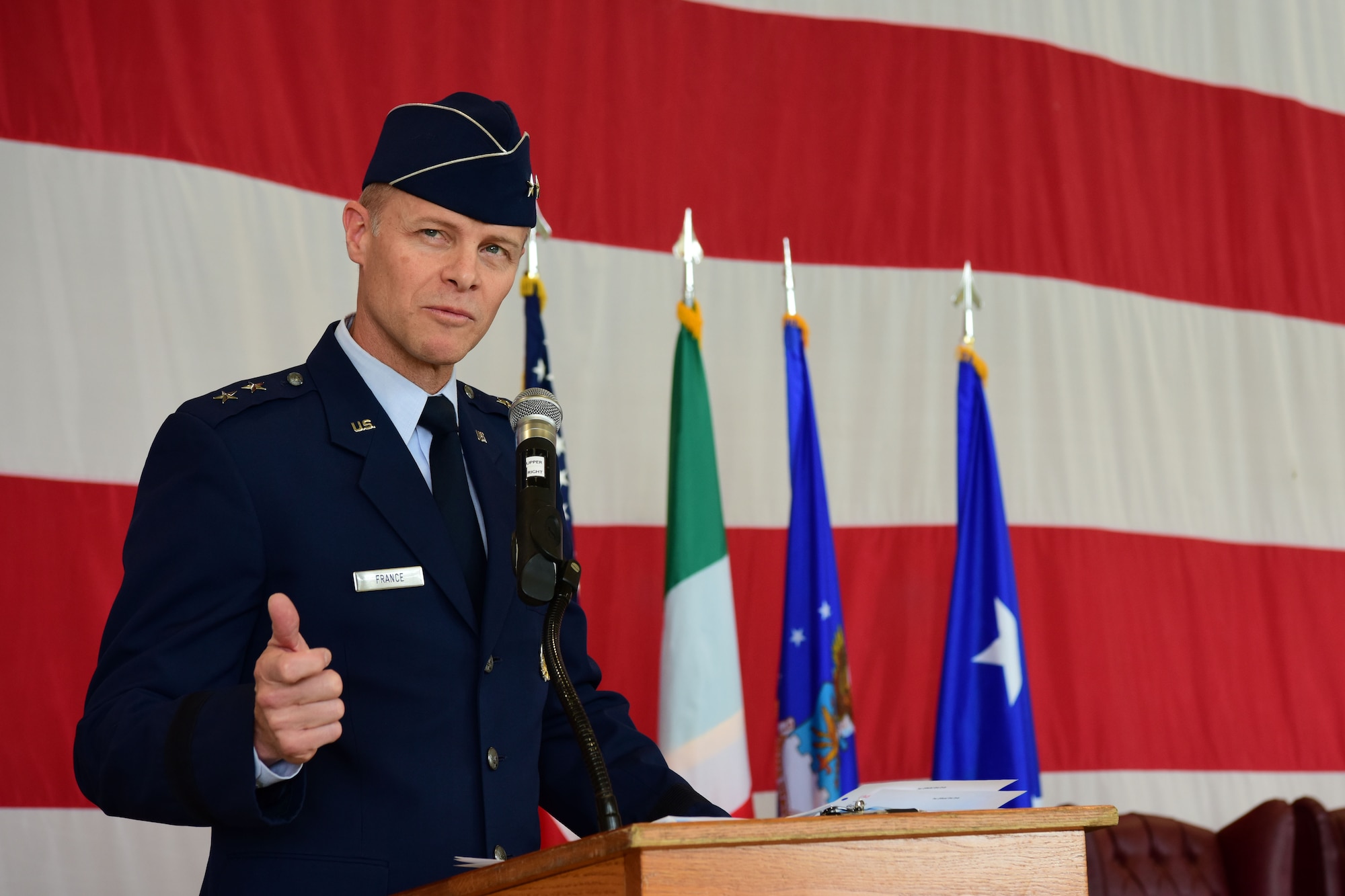 U.S. Air Force Maj. Gen. Derek C. France, 3rd Air Force commander, speaks at the 31st Fighter Wing change of command at Aviano Air Base