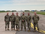 From left, Pennsylvania Air National Guard Lt. Col. Frank Shoaf, Chief Master Sgt. Jason Everetts, Capt. Matthew Reed, Master Sgt. Frankie Perez, Chief Master Sgt. Andrew Mowry and Capt. Benjamin Kaufman with the 171st Air Refueling Wing’s 258th Air Traffic Control Squadron at Siauliai Air Base, Lithuania, during the Defender Europe 22 exercise, June 2022. The Pennsylvania Guard and Lithuania are partners under the Department of Defense National Guard Bureau State Partnership Program.