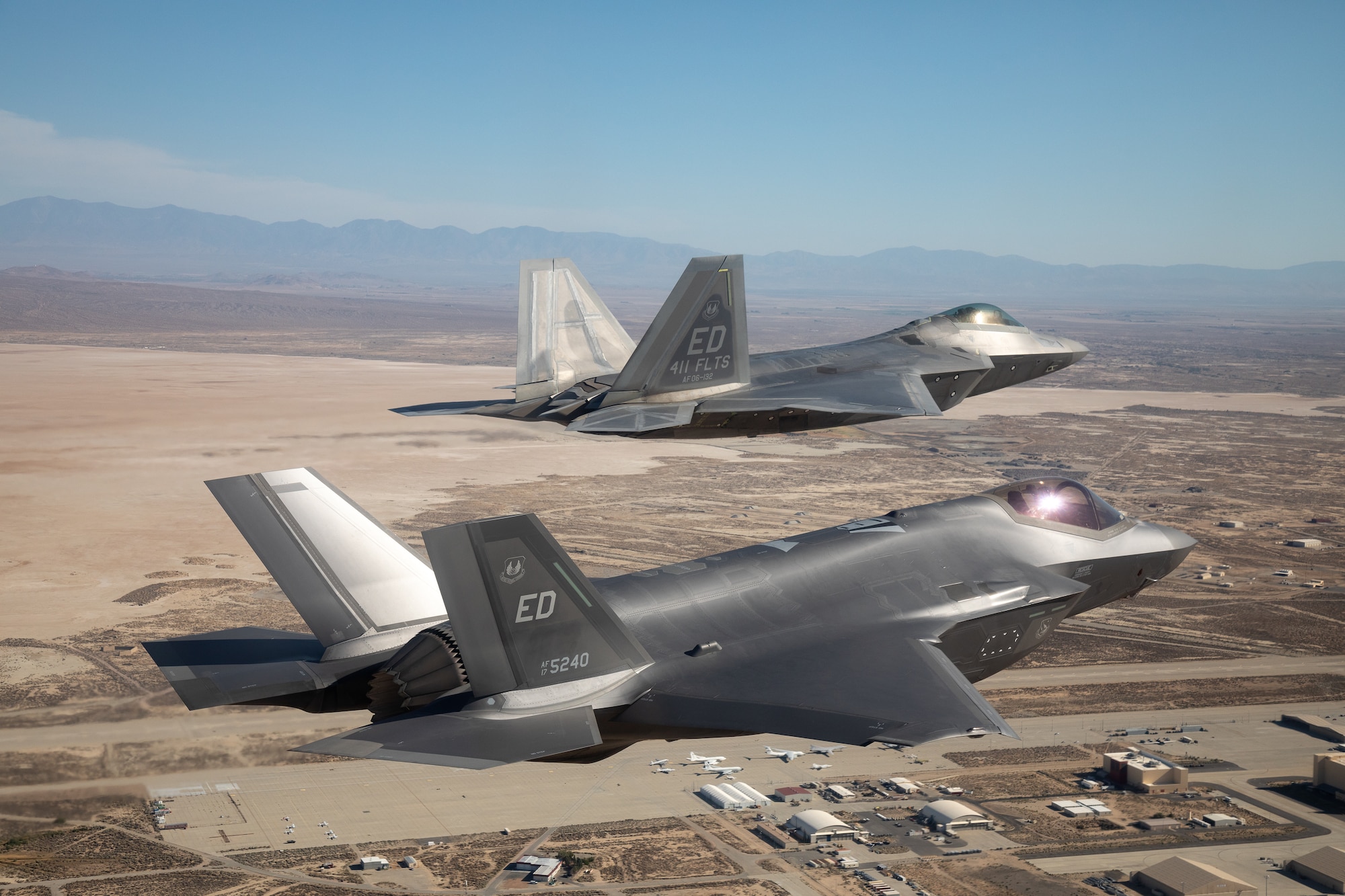 An F-22 Raptor from the 411th Flight Test Squadron and and F-35 Lightning II from the 461st Flight Test Squadron return to Edwards Air Force Base, California following a flyover during the 2022 MLB All-Star Game opening ceremony at Dodger Stadium in Los Angeles, July 19. (Photo courtesy of Kyle Larson/Lockheed Martin)