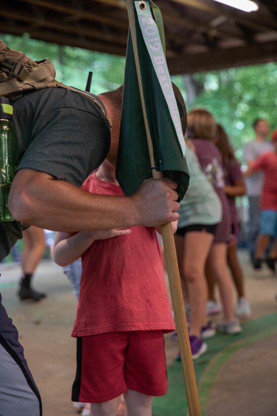 Chief Warrent Officer Kevin Fraley speaks to one of his campers at the Kentucky National Guard (KYNG) Child and Youth Camp at the Lake Cumberland 4-H Camp in Nancy, Ky. on July 18-22, 2022. This is Fraleys's fourth time volenteering at KYNG Child and Youth Services Camp. (U.S. Army phot by Pfc. Georgia Napier)