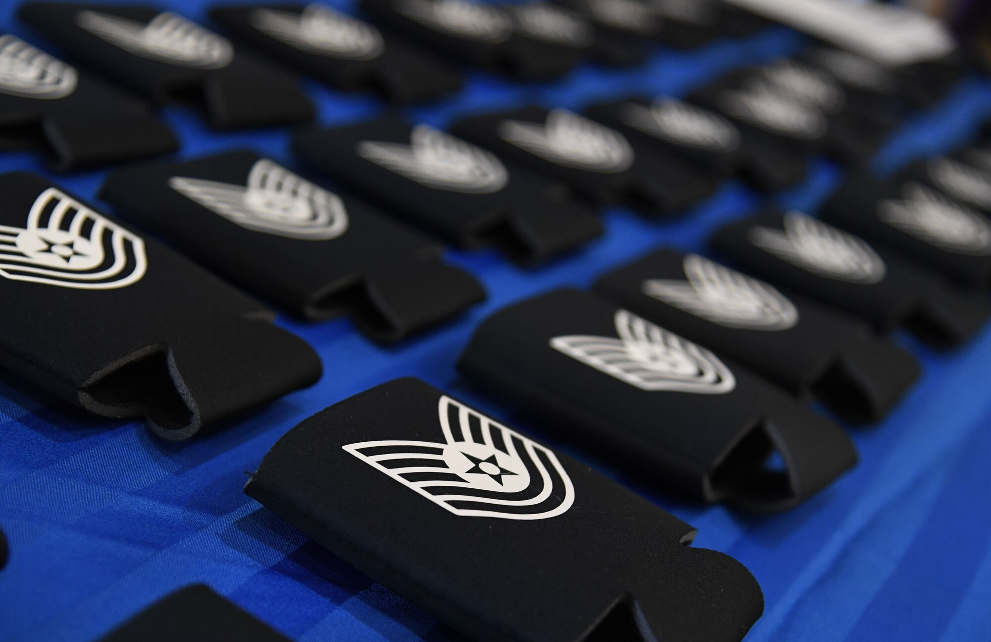 Koozies are on display during the technical sergeant select release celebration inside the Bay Breeze Event Center at Keesler Air Force Base, Mississippi, July 21, 2022. More than 20 Airmen were recognized during the event. (U.S. Air Force photo by Kemberly Groue)
