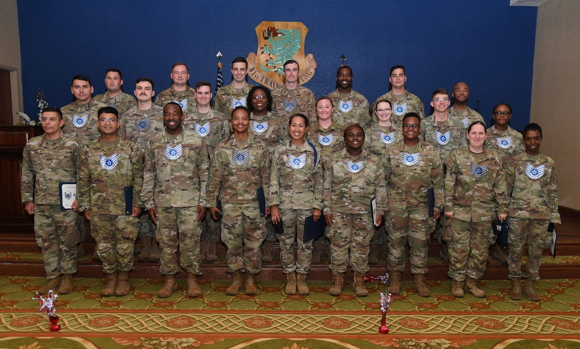Staff sergeants pose for a group photo during the Technical Sergeant select release celebration inside the Bay Breeze Event Center at Keesler Air Force Base, Mississippi, July 21, 2022. More than 20 Airmen were recognized during the event. (U.S. Air Force photo by Kemberly Groue)