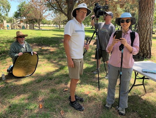 U.S. Army Corps of Engineers Los Angeles District public affairs set up lights, camera, audio equipment and rehearse with the lead actress before a video production at the Santa Fe Dam Recreational Park May 31 in LA County.