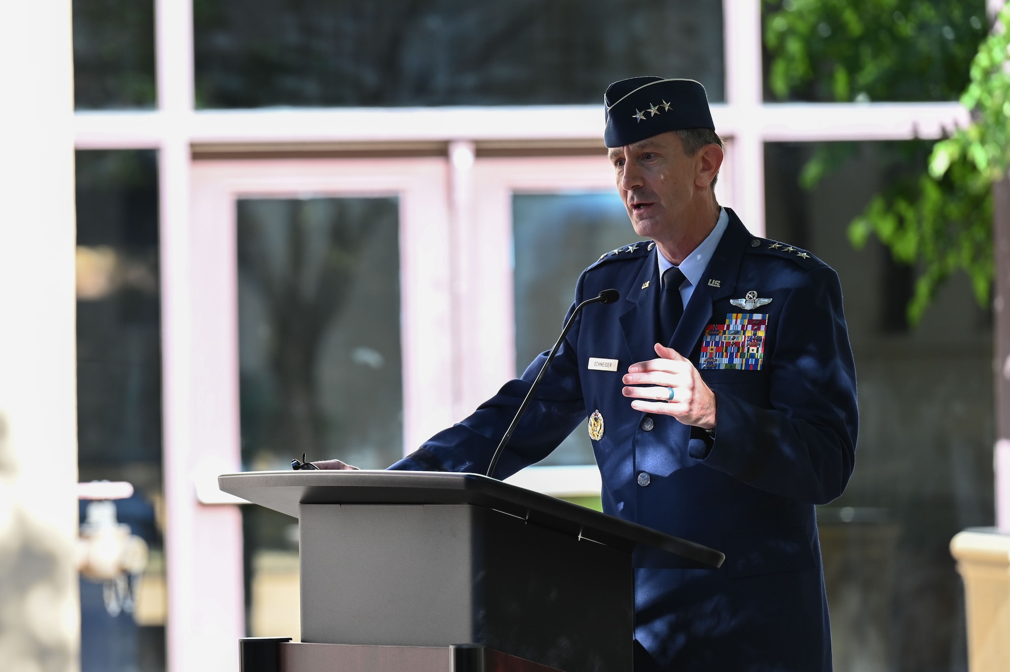Lt. Gen. Kevin Schneider, left, United States Air Force Director of Staff delivers comments during the July 19, 2022 Air Force Operational Test and Evaluation Center Change of Command Ceremony.