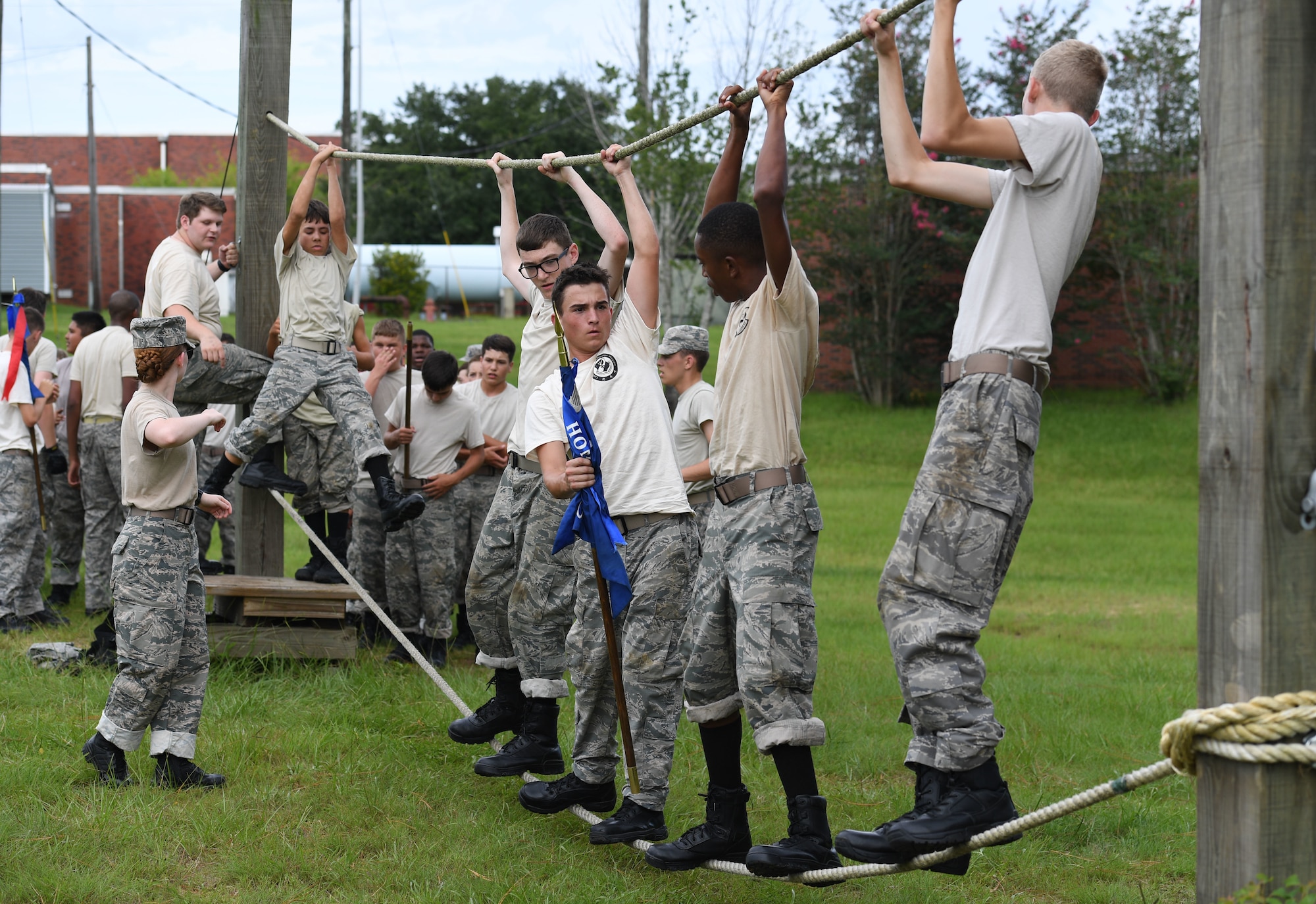 Louisiana Civil Air Patrol cadets participate in an obstacle course at Harrison Central High School at Gulfport, Mississippi, July 22, 2022. More than 50 cadets attended the Louisiana Wing Encampment at Keesler Air Force Base, Mississippi, from July 14-24. (U.S. Air Force photo by Kemberly Groue)