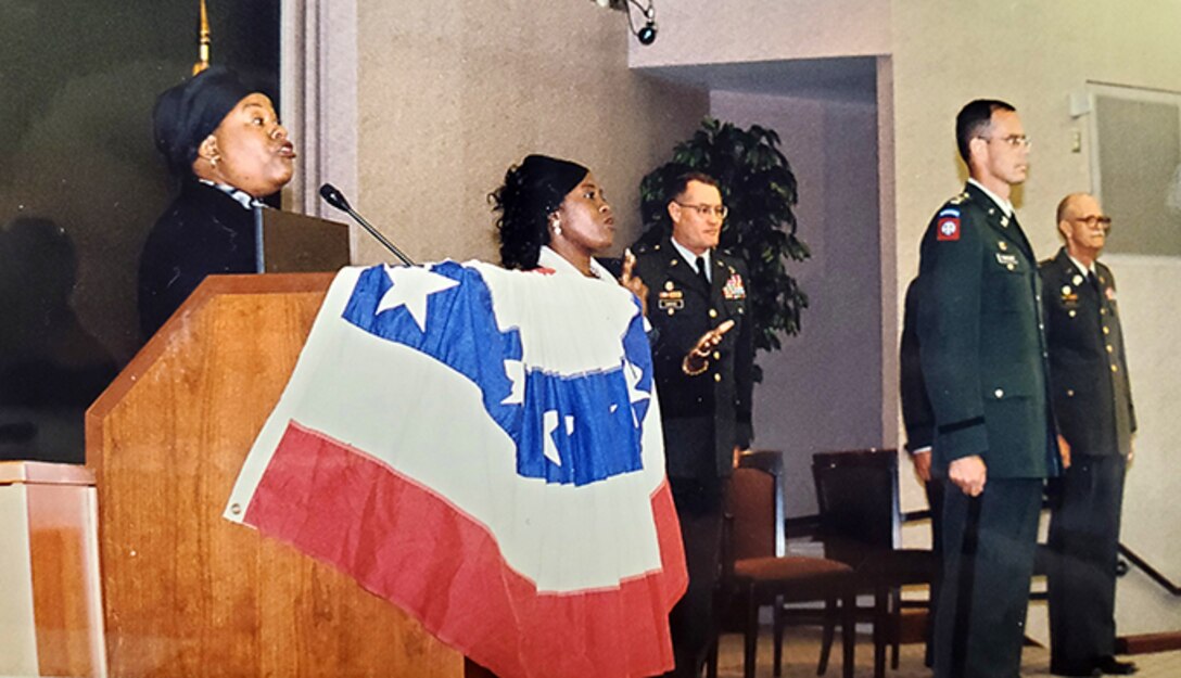 Shonka Dukureh (Left), performs the National Anthem July 13, 2001, during the U.S. Army Corps of Engineers Nashville District's Change of Command Ceremony in Nashville, Tennessee. The singer and actress in the recently released movie Elvis passed away July 21, 2022, at the age of 44. The Nashville District is remembering her time as a public servant (USACE Photo)