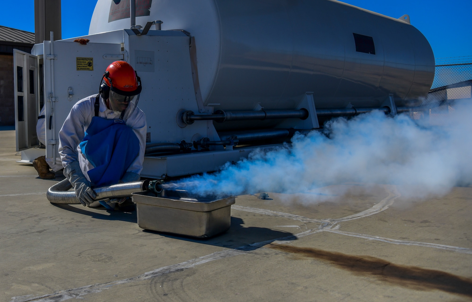 Airman 1st Class Randy Willis 9th Logistic Readiness Squadron, cryogenics technician, purges a hose at Beale Air Force Base, California, July 21, 2022