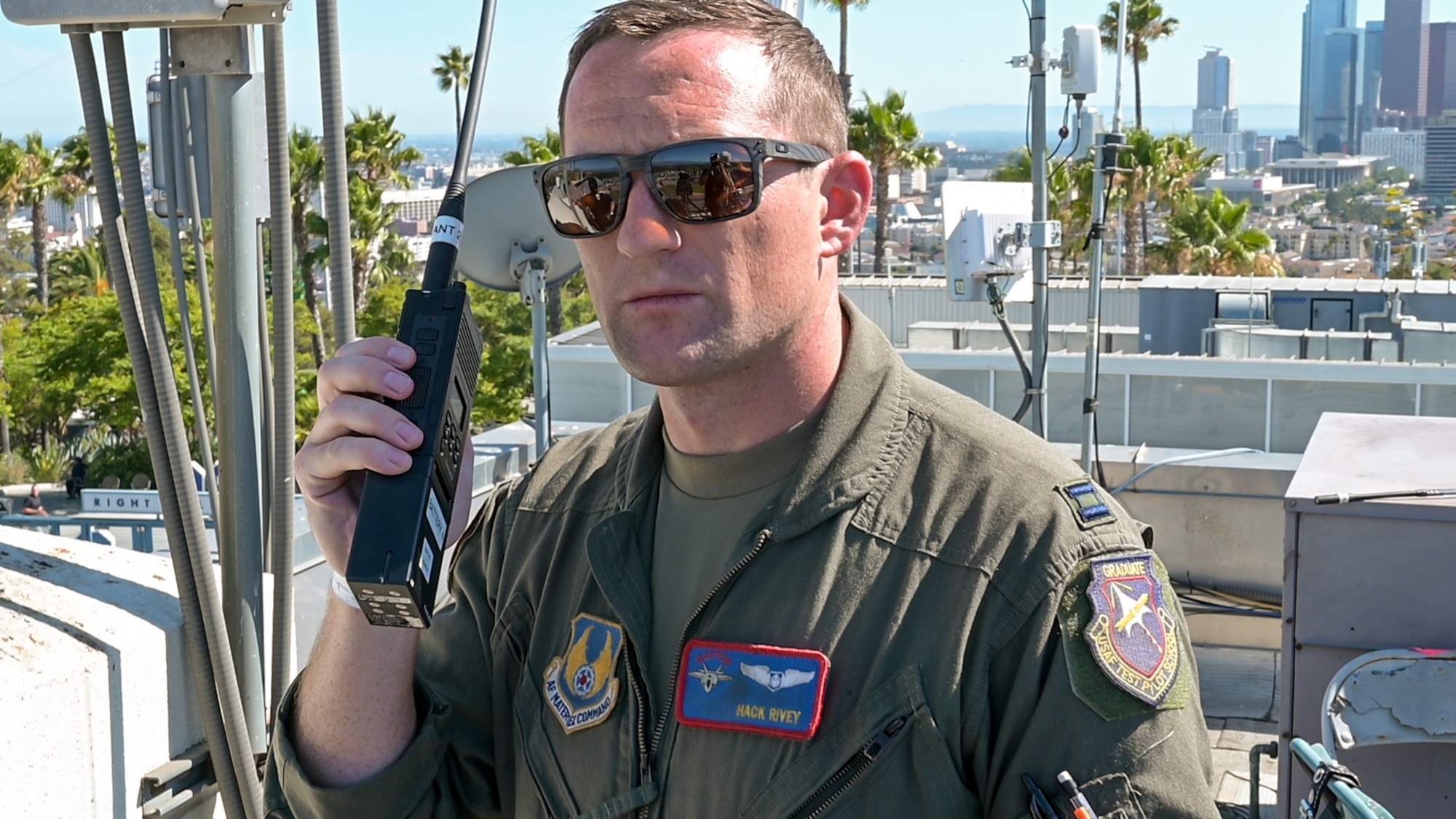 Capt. Joshua Rivey, 411th Flight Test Squadron, 412th Test Wing, coordinates with aircrew to adjust the time-on-target for the opening ceremony of the 2022 MLB All-Star Game at Dodger Stadium in Los Angeles, July 19. (Air Force photo by Adam Bowles)