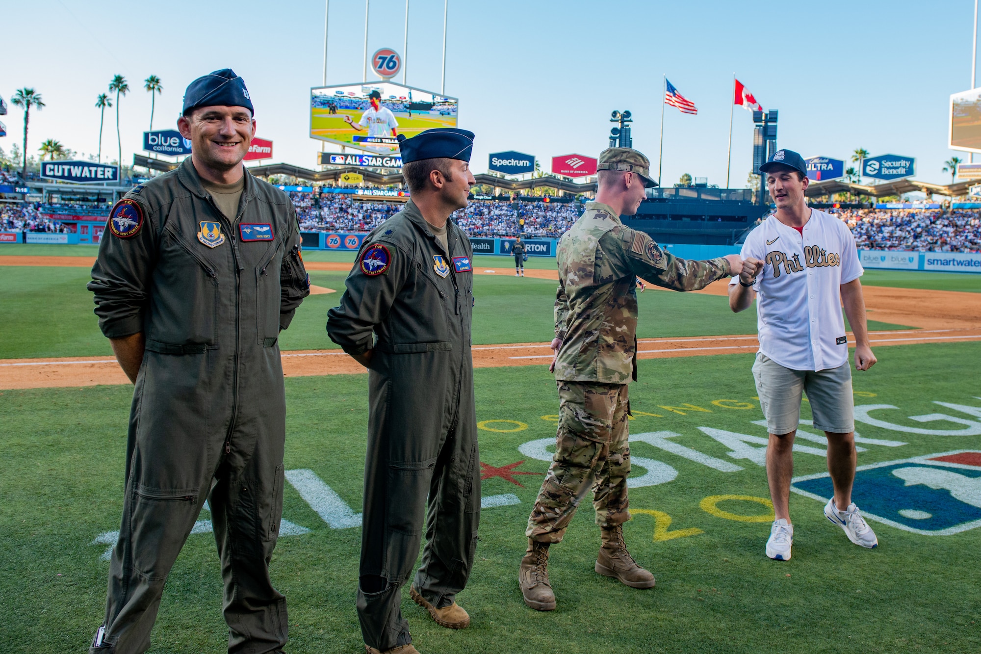 “Top Gun: Maverick” actor Miles Teller fist bumps Senior Airman Michael Batuski, 412th Aircraft Maintenance Squadron, during the 2022 MLB All-Star Game at Dodger Stadium in Los Angeles, July 19. (Air Force photo by Madeline Guadarrama)