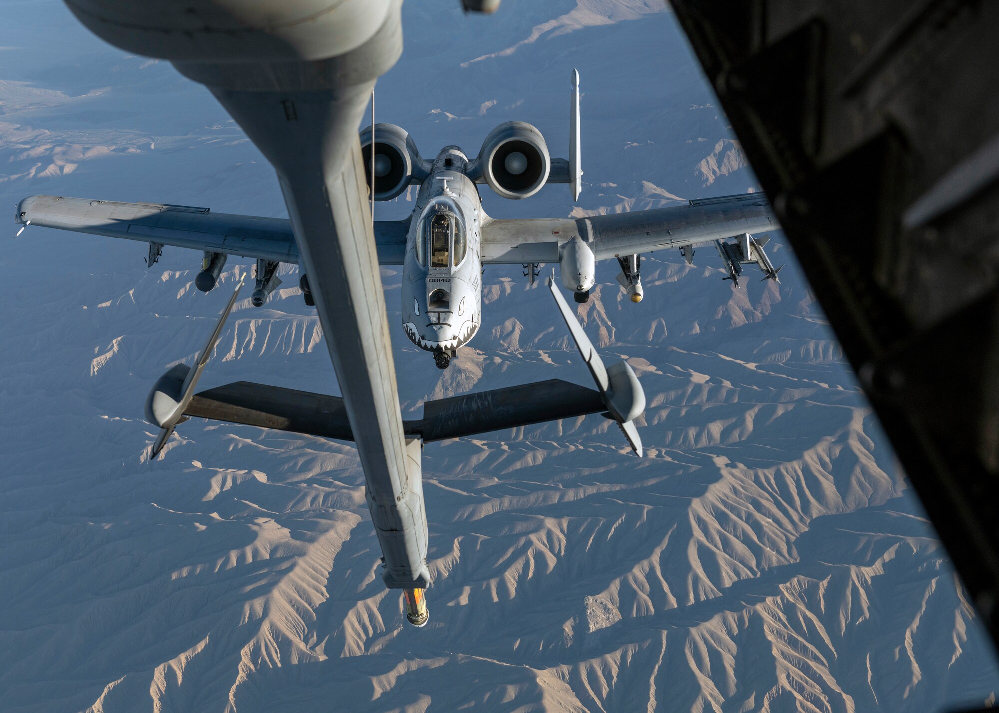 An A-10 Thunderbolt II assigned to Moody Air Force Base, Ga., flies below a KC-10 Extender